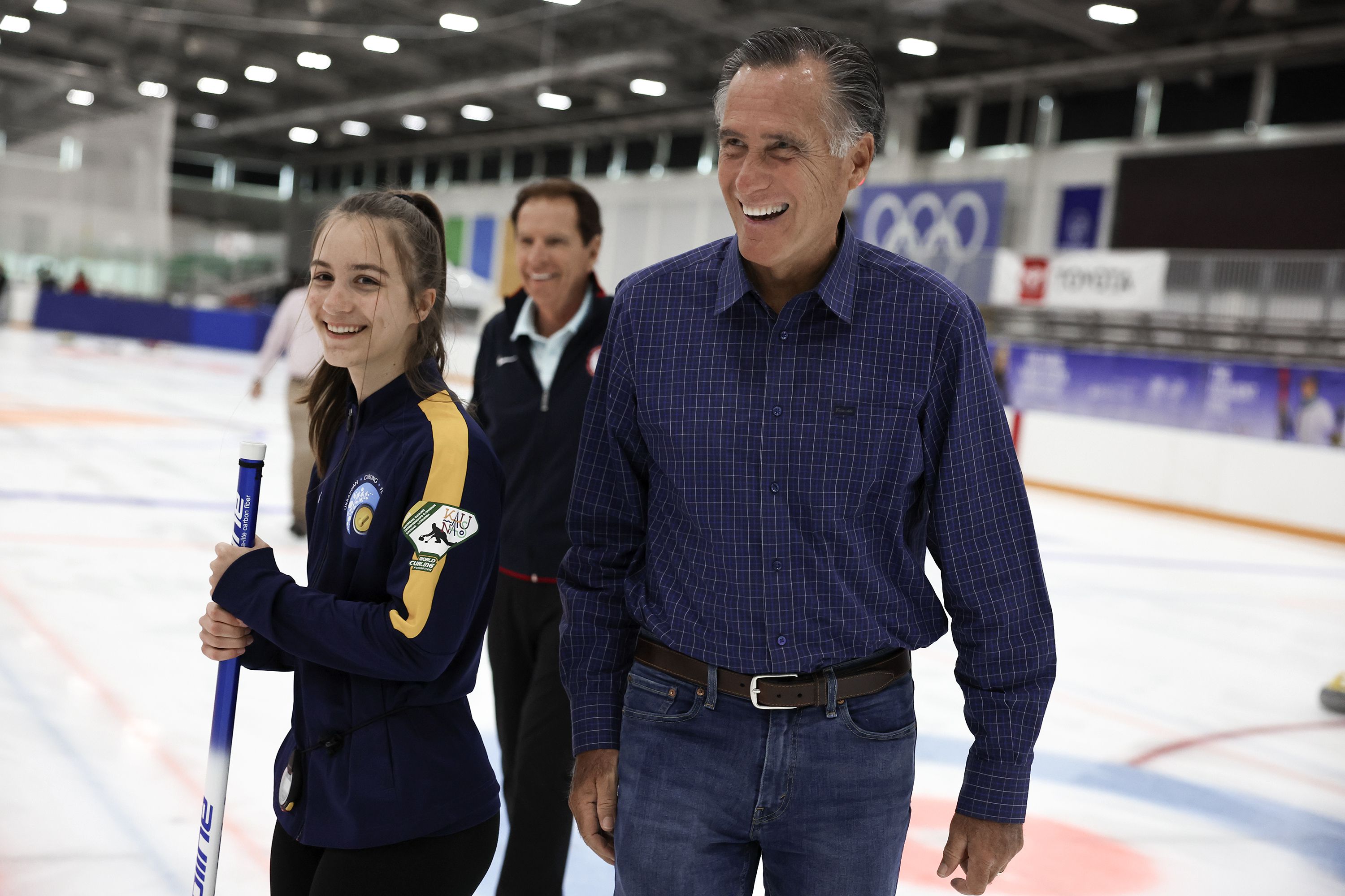 Sen. Mitt Romney, R-Utah, right, and Fraser Bullock, president and CEO of the Salt Lake City-Utah Committee for the Games, center, speak with Ukrainian Olympians at the Utah Olympic Oval in Kearns on Friday, May 27.