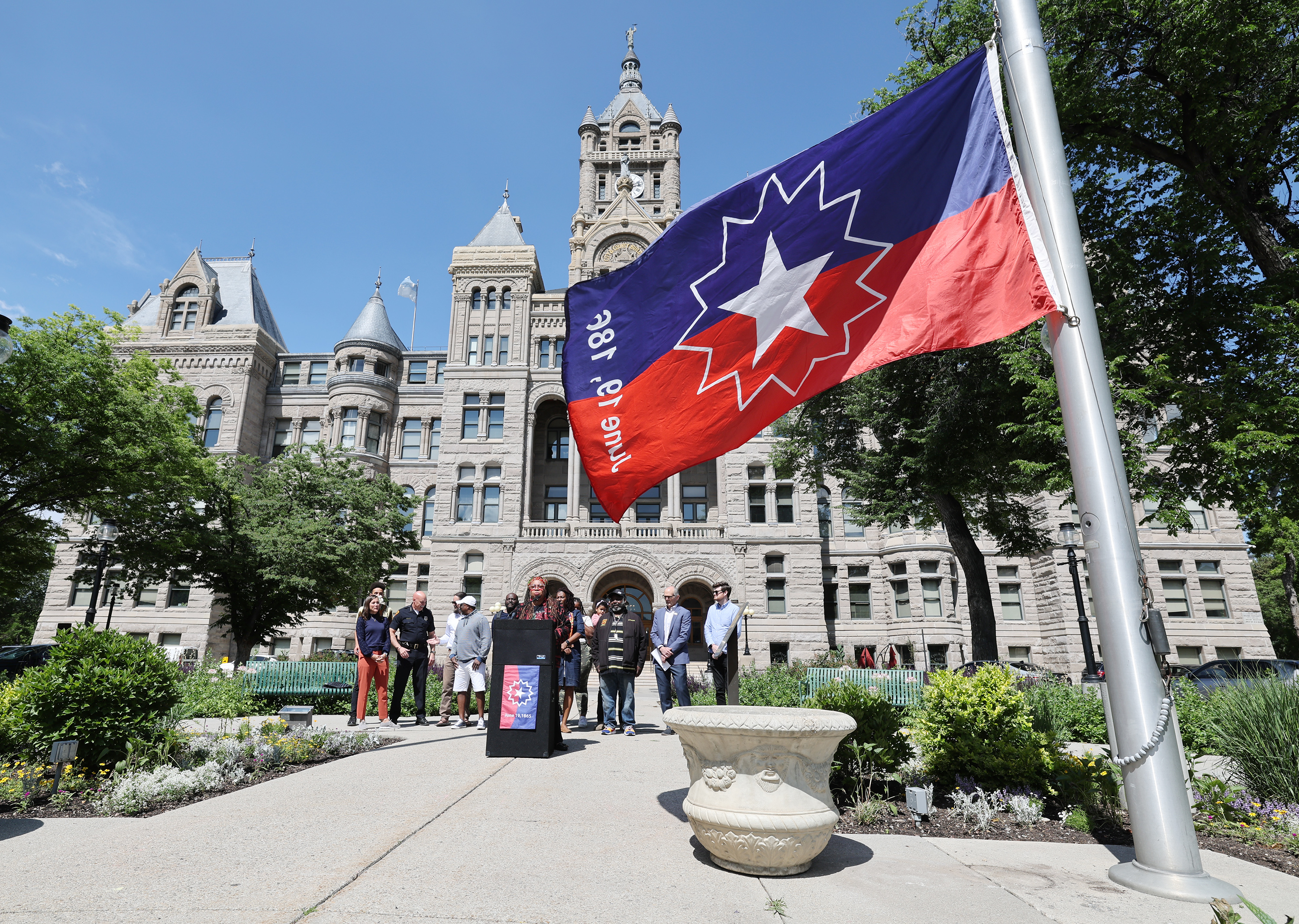 Betty Sawyer joins other leaders to raise the Juneteenth flag at the Salt Lake City-County Building on June 14, 2022. This year's holiday will be marked by an Ogden festival, a Salt Lake City ceremony and more.