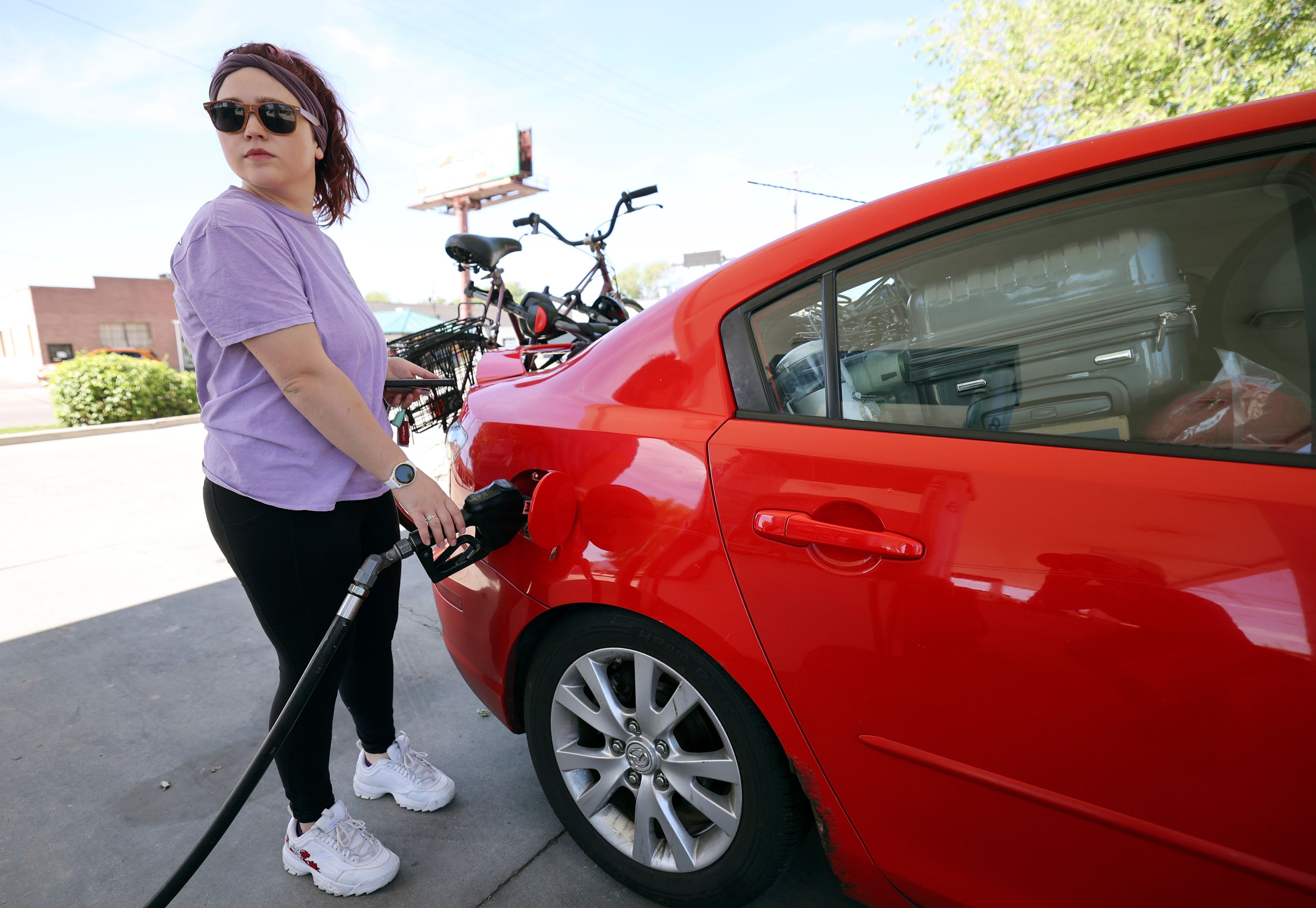 Charlene Helmuth pumps gas at Shopper’s Express in Salt Lake City on June 2. Some Democratic Party leaders are using the word “greedflation” to describe the ongoing, record-high inflation across the U.S.