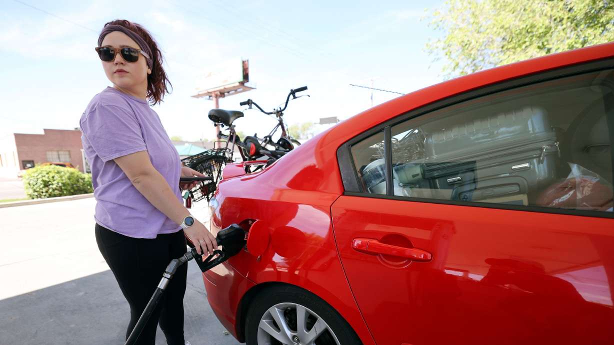 Charlene Helmuth pumps gas at Shopper’s Express in Salt Lake City on June 2. Some Democratic Party leaders are using the word “greedflation” to describe the ongoing, record-high inflation across the U.S.