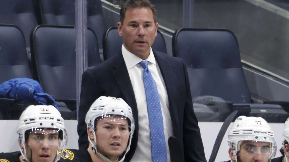 FILE - Boston Bruins coach Bruce Cassidy watches during the third period of the team's NHL hockey game against the New York Islanders on Feb. 17, 2022, in Elmont, N.Y. The Vegas Golden Knights named Cassidy as the team's coach Tuesday, June 14.