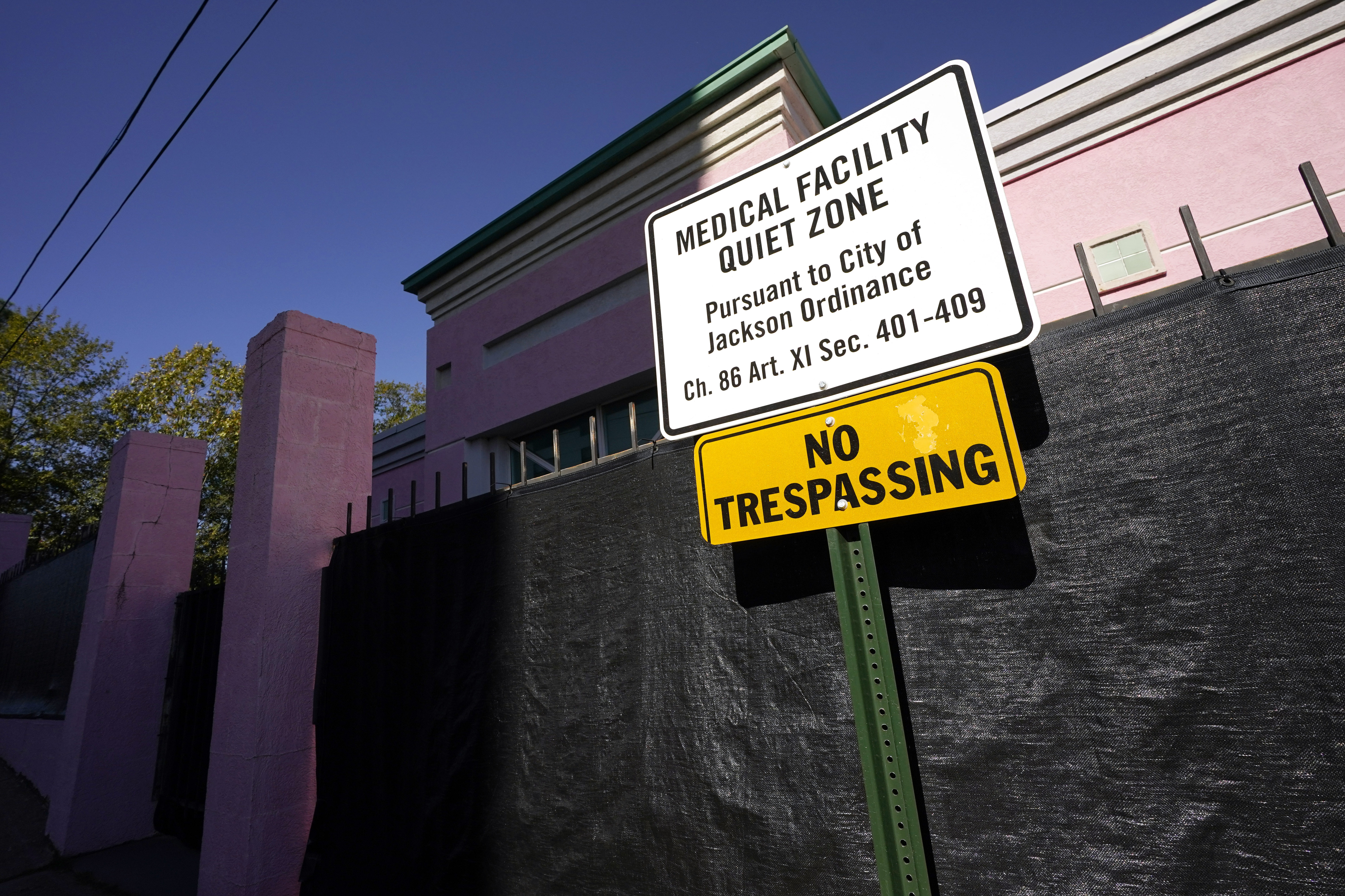 A sign indicating a "Medical Facility Quiet Zone" is displayed outside the Jackson Women's Health Organization clinic in Jackson, Miss., Nov. 18, 2020. According to a report from the Guttmacher Institute released on Tuesday, fewer women were getting pregnant and a larger share of them chose abortion.