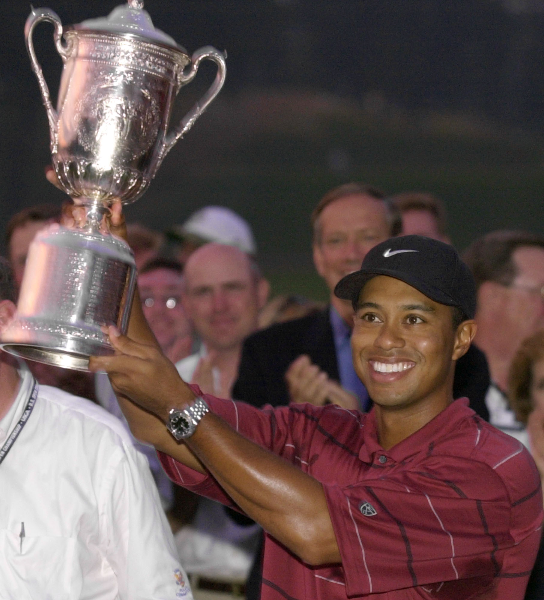 Tiger Woods holds the 2002 U.S. Open golf tournament trophy after winning at the Black Course of Bethpage State Park in Farmingdale, N.Y. It was the second of his three U.S. Open titles.