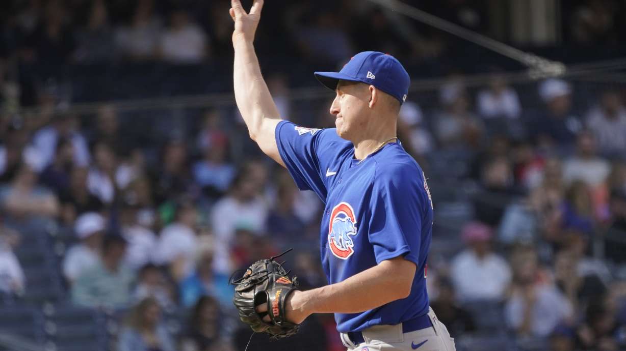 Chicago Cubs first baseman Frank Schwindel pitches in the eighth inning of a baseball game against the New York Yankees, Sunday, June 12, 2022, in New York.