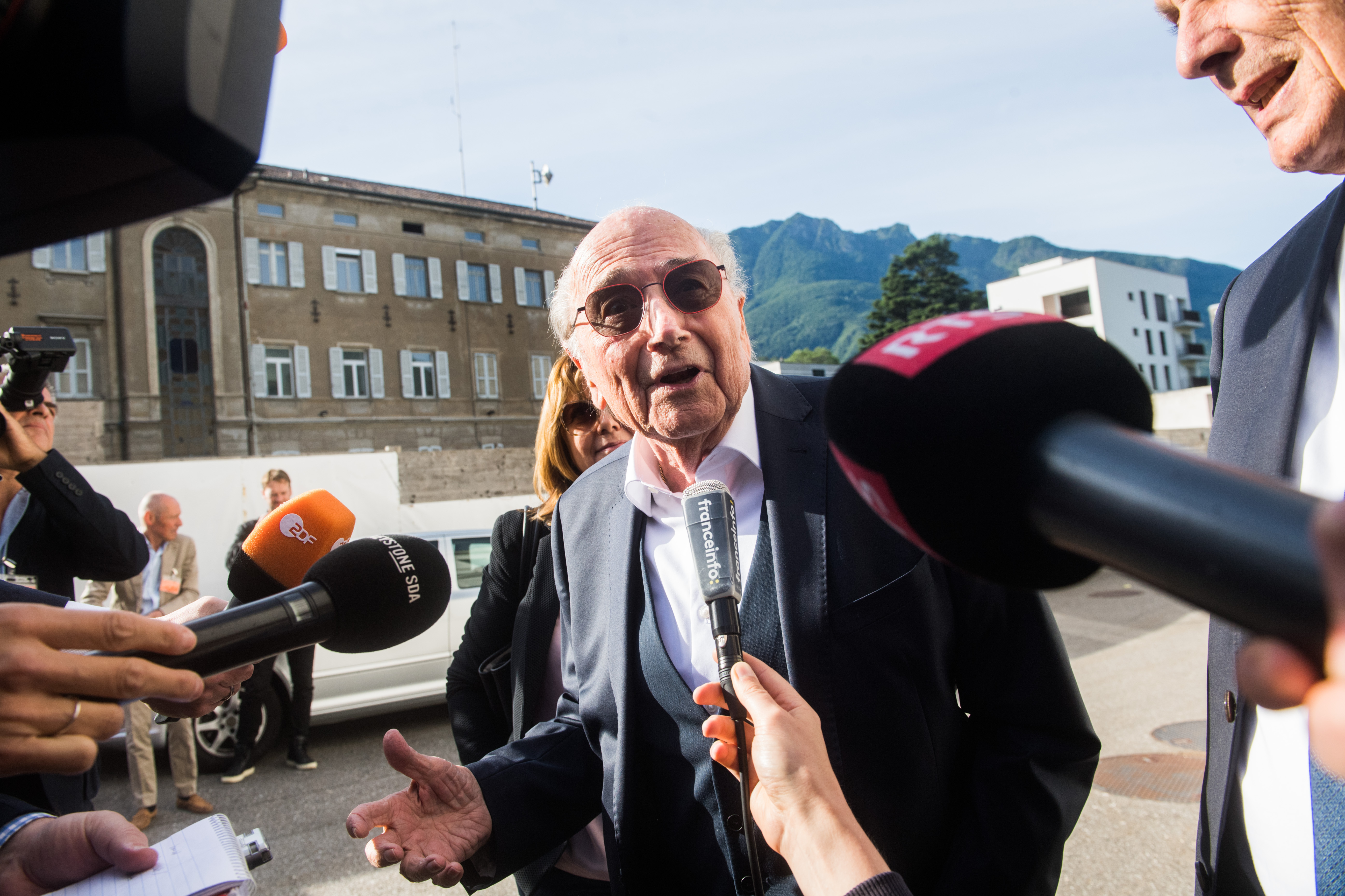 The former president of the World Football Association (FIFA), Joseph Blatter, speaks as he arrives at the Swiss Federal Criminal Court in Bellinzona, Switzerland, Wednesday, June 8, 2022. Blatter and the former president of the the European Football Association (UEFA), Michel Platini, will stand trial before the Federal Criminal Court from Wednesday, over a suspicious two-million payment. 