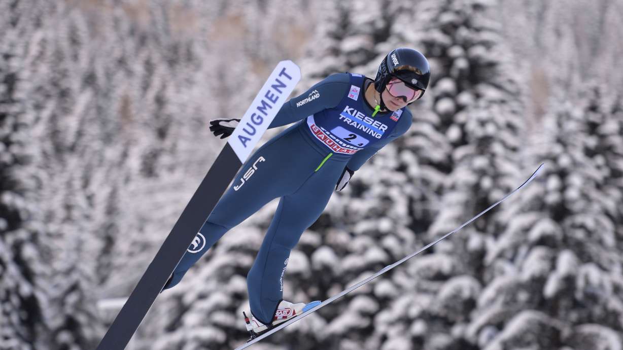 FILE - United States' Annika Malacinski competes during the Nordic combined World Cup mixed team normal hill HS 106, in Val di Fiemme, Italy, Jan. 7, 2022. Malacinski is one of dozens of women around the world who are in it for the glory, sacrificing a lot of time and money to go for Olympic gold.