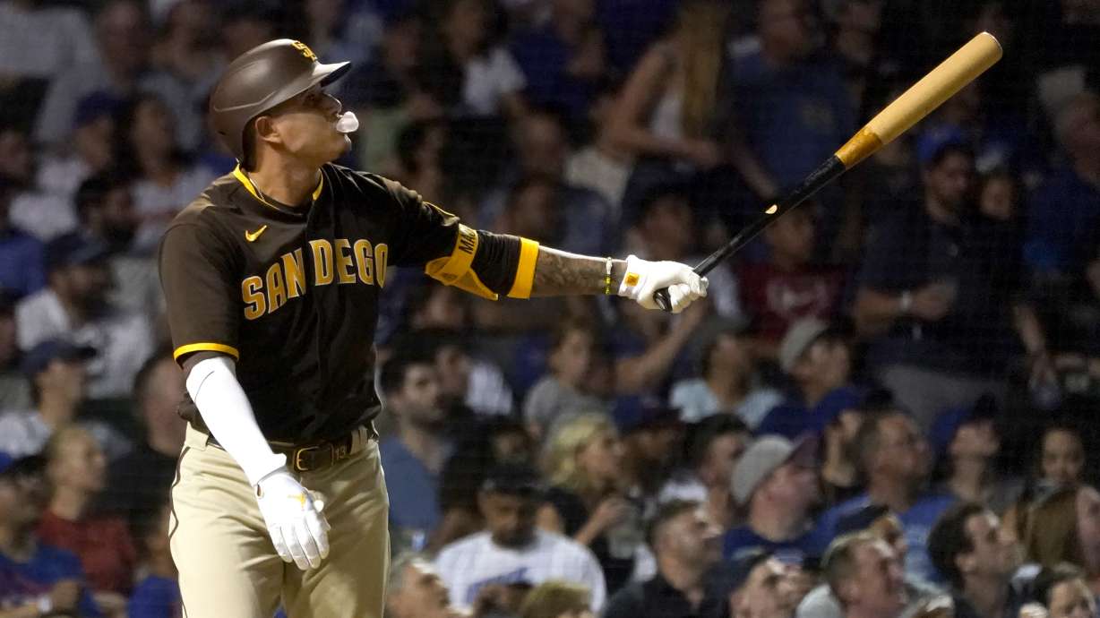 San Diego Padres' Manny Machado blows a bubble as he watches his two-run home run off Chicago Cubs relief pitcher Rowan Wick during the fifth inning of a baseball game Wednesday, June 15, 2022, in Chicago.
