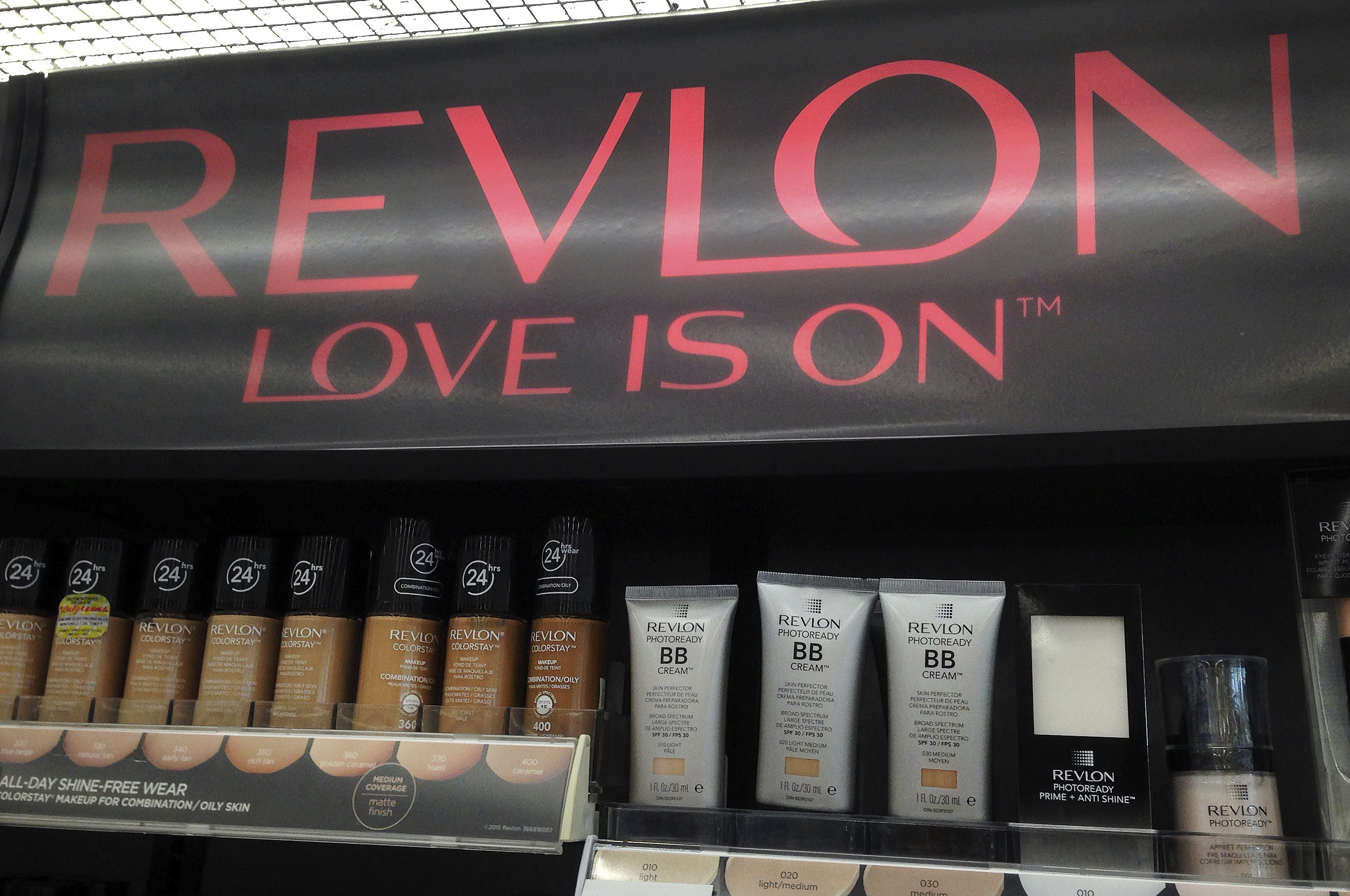 Revlon products are on display in a store July 5, 2016, in North Andover, Mass. Revlon has filed for Chapter 11 bankruptcy Thursday.