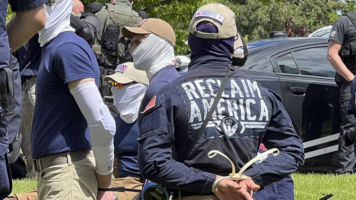 Authorities arrest suspected members of the white supremacist group Patriot Front near an Idaho Pride event Saturday, June 11, after they were found packed into the back of a U-Haul truck with riot gear.