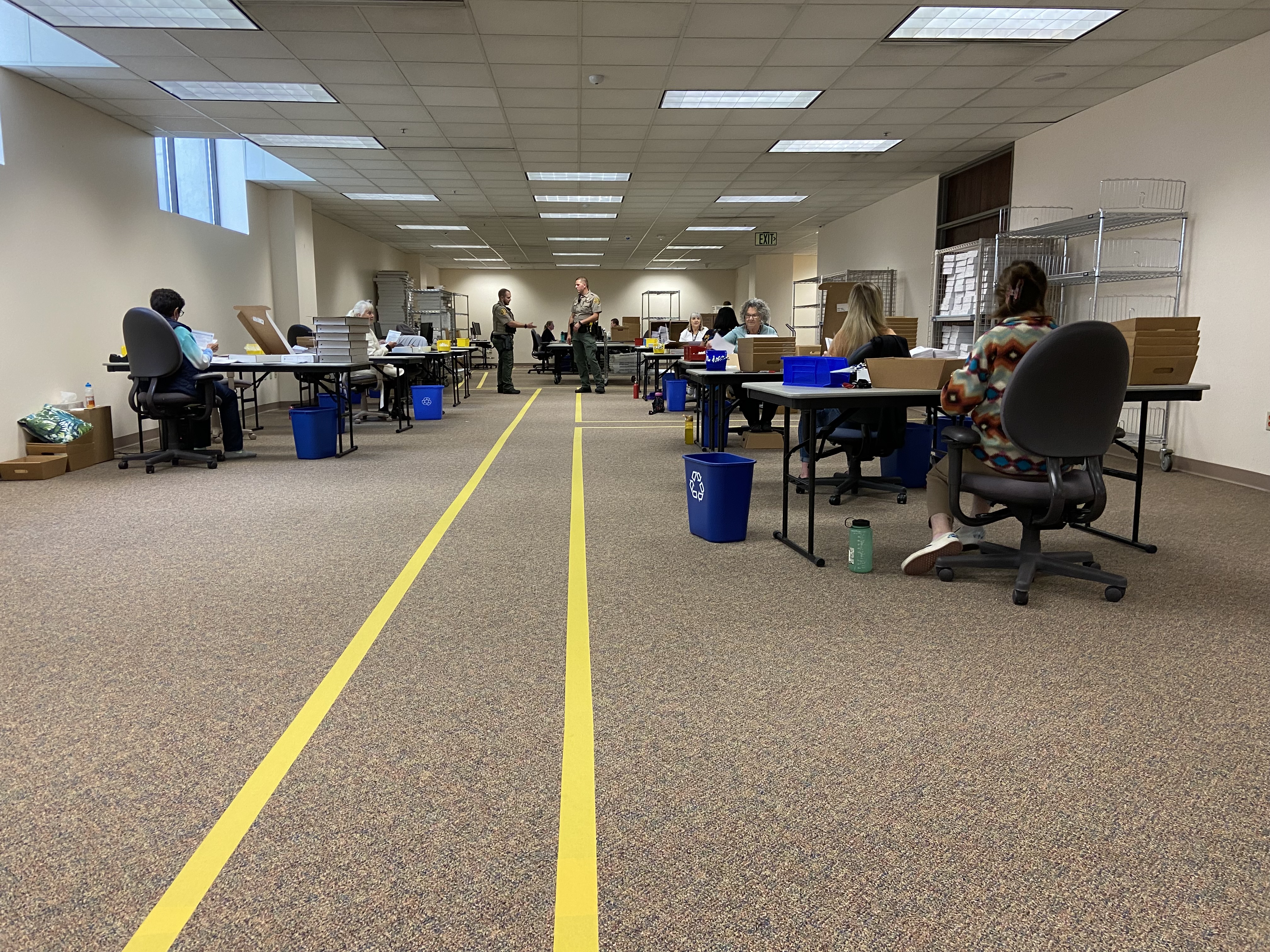 Yellow lines show where poll watchers can stand in the Salt Lake County Clerk's Office during the primary election on June 28.