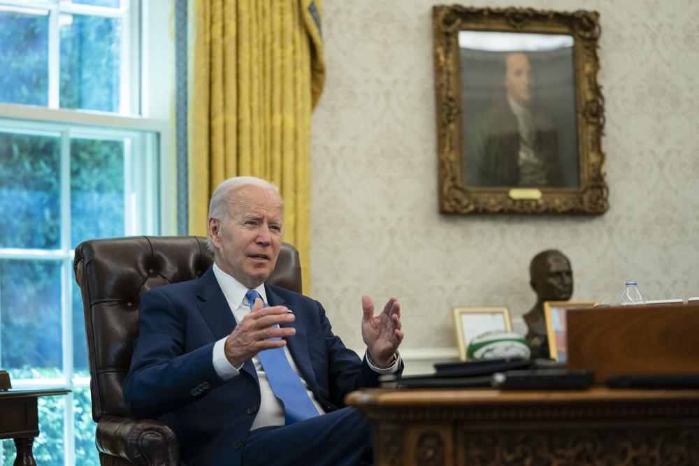 President Joe Biden speaks during an interview with the Associated Press in the Oval Office of the White House, Thursday in Washington. Biden says Americans are "really, really down" after a tumultuous two years, but a recession is not inevitable.