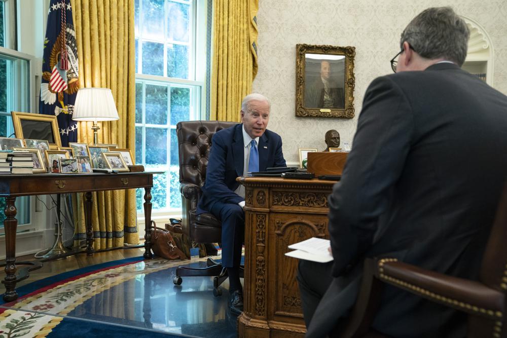 President Joe Biden speaks during an interview with the Associated Press in the Oval Office of the White House, Thursday in Washington. Biden says Americans are "really, really down" after a tumultuous two years, but a recession is not inevitable.