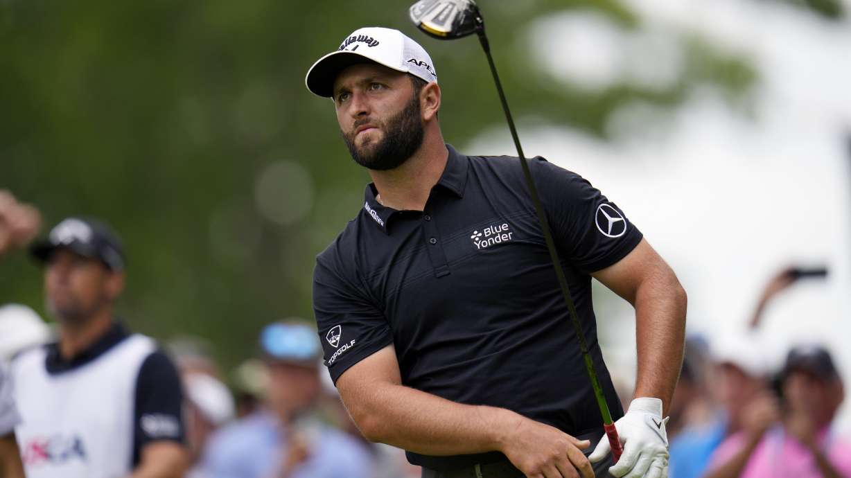 Jon Rahm, of Spain, watches his shot on the 15th hole during the first round of the U.S. Open golf tournament at The Country Club, Thursday, June 16, 2022, in Brookline, Mass.
