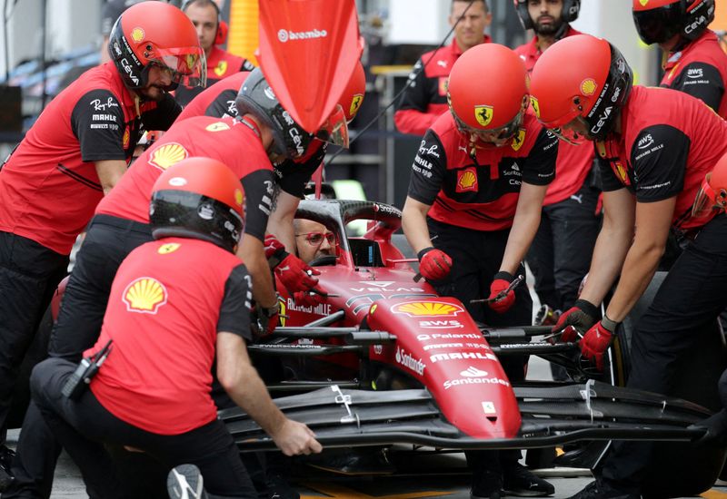 Formula One F1 - Canadian Grand Prix - Circuit Gilles Villeneuve, Montreal, Canada - June 16, 2022 Ferrari engineers with Ferrari's Charles Leclerc's car ahead of the Canadian Grand Prix