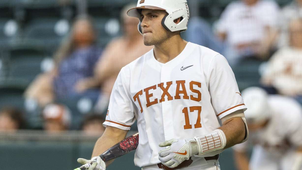 FILE - Texas first baseman Ivan Melendez walks to the batters box against Stephen F. Austin during an NCAA baseball game on Tuesday, April 12, 2022, in Austin, Texas. The 16 NCAA regional hosts will be announced on Sunday, May 29, 2022.