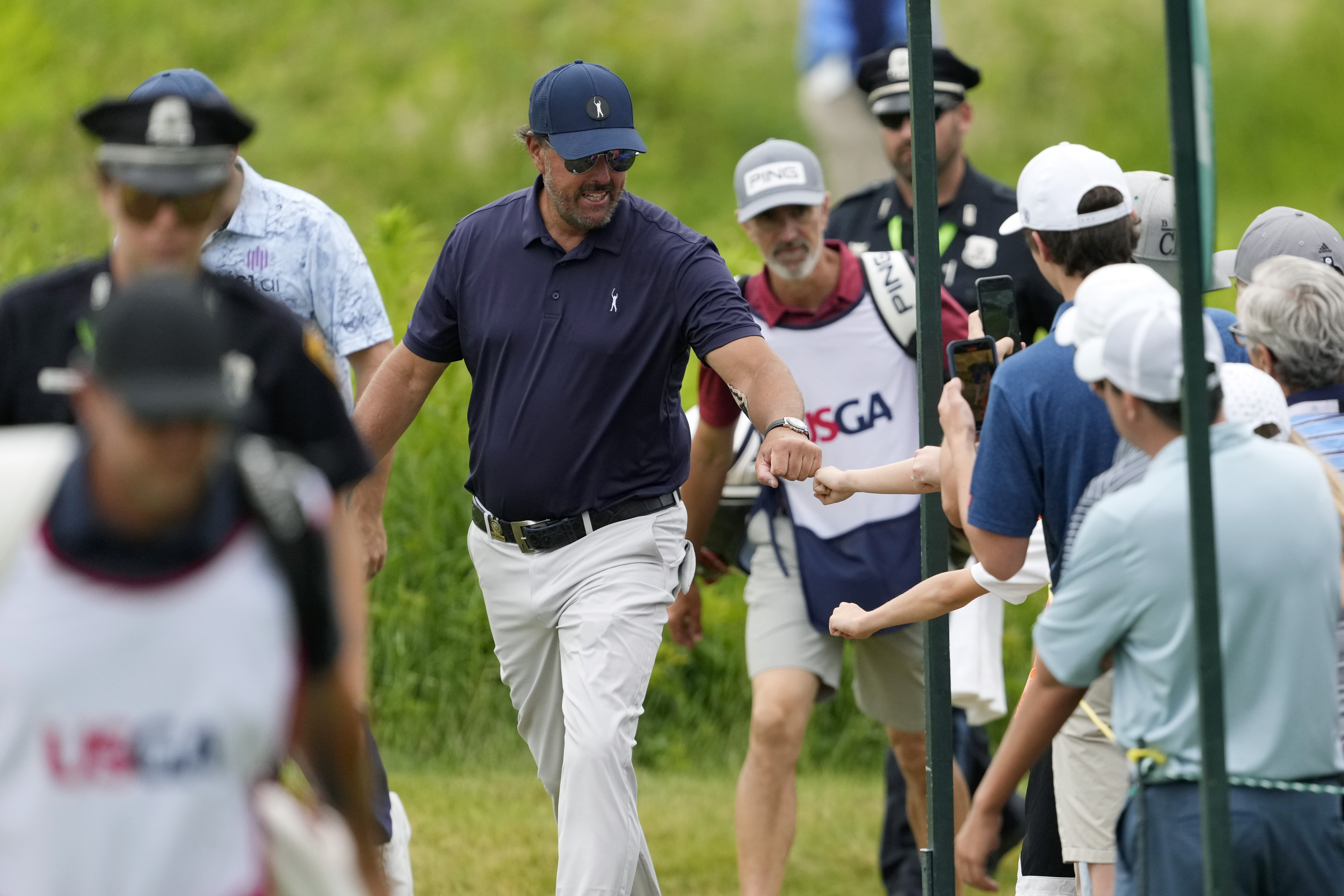 Phil Mickelson greets fans during the second round of the U.S. Open golf tournament at The Country Club, Friday, June 17, 2022, in Brookline, Mass. 