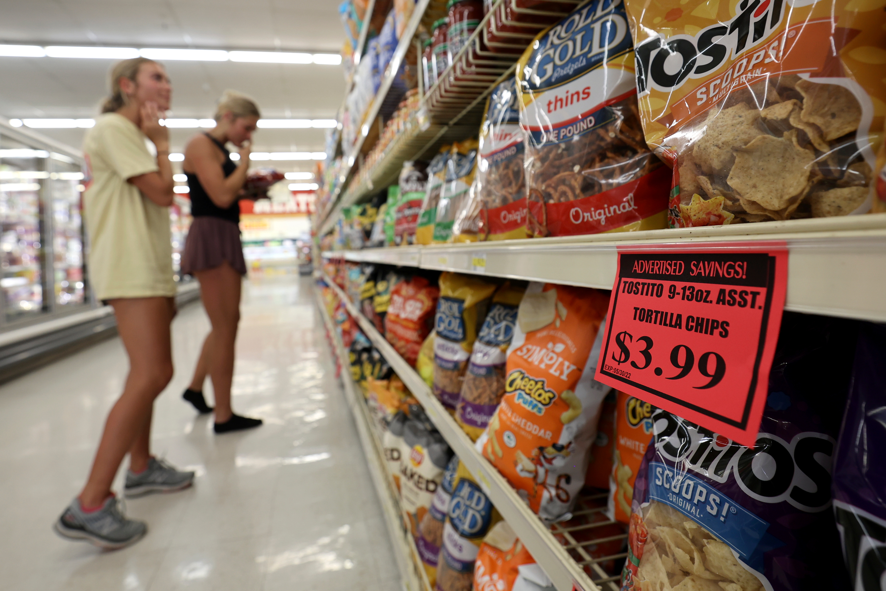 Elle Johnsen and Maddy La Fleur shop for chips at a Reams in Sandy on May 18. Consumers like digital coupons, according to data shared with the KSL Investigators. But that same data shows most coupons on the market today are still paper.