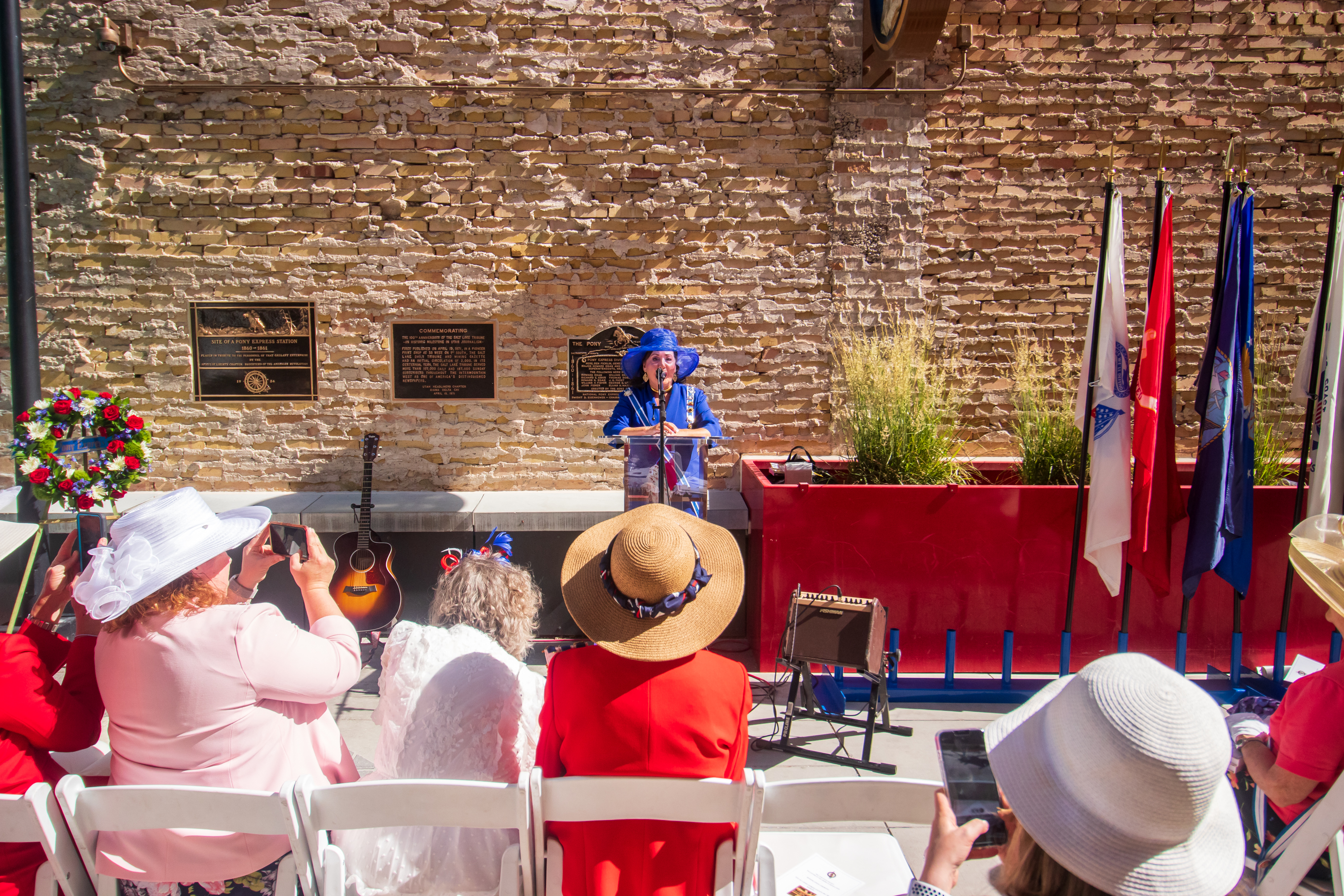 Kathryn Asay, the Utah state regent for the National Society Daughters of the American Revolution, speaks during a rededication ceremony for three plaques outside of the Tribune Building in Salt Lake City. Two of the plaques celebrate the history of the Pony Express at the location of a station in the city in 1860 and 1861.