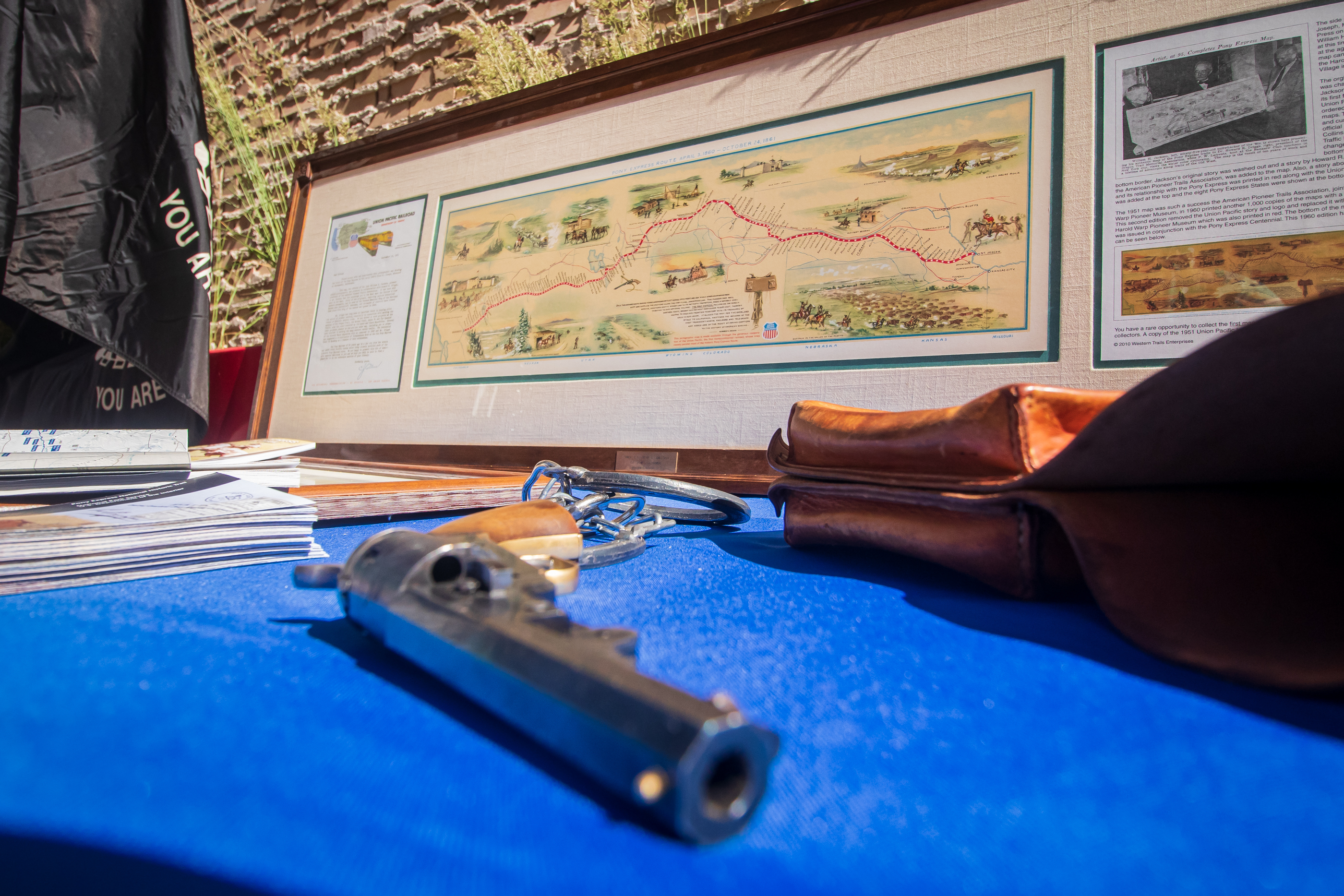 Artifacts and replica items of the types of equipment Pony Express riders wore and the route they took are placed on a table outside of the Tribune Building in Salt Lake City on Friday morning. The Pony Express lasted from April 1860 to October 1861.