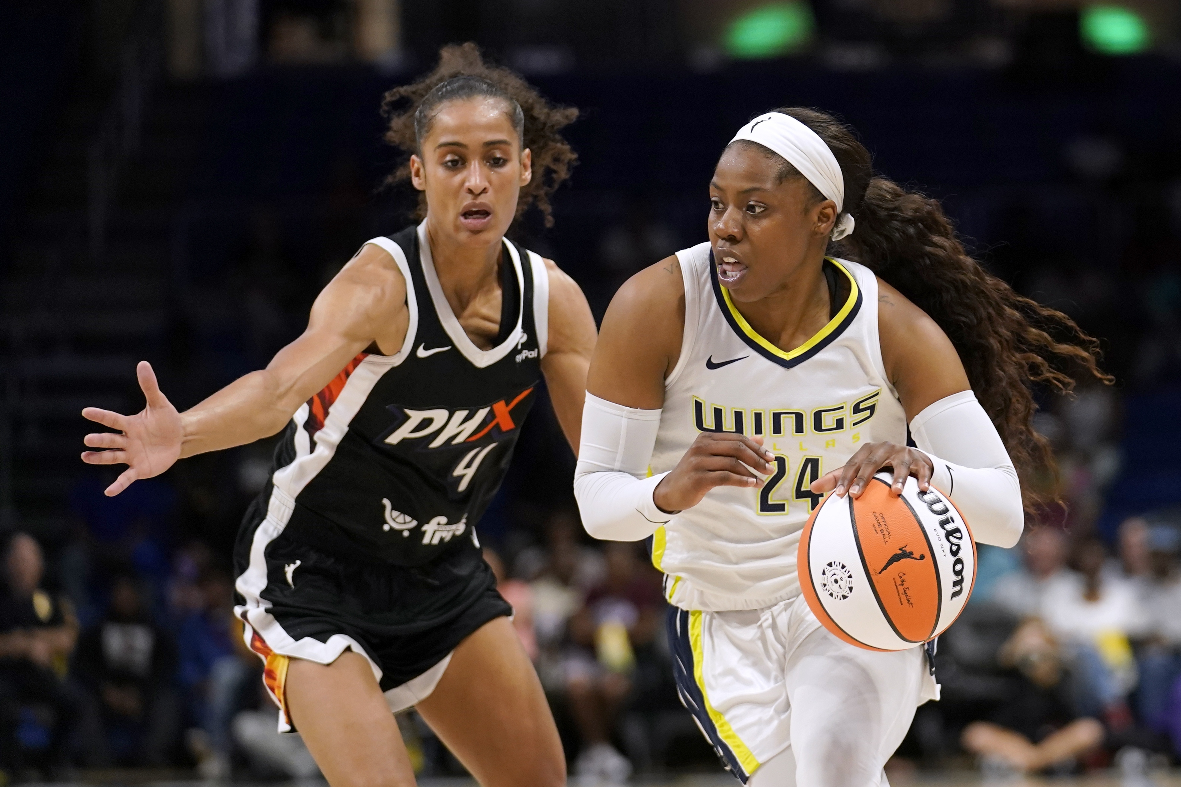 Phoenix Mercury guard Skylar Diggins-Smith (4) defends against Dallas Wings guard Arike Ogunbowale (24) during the first half of a WNBA basketball game Friday, June 17, 2022, in Arlington, Texas.