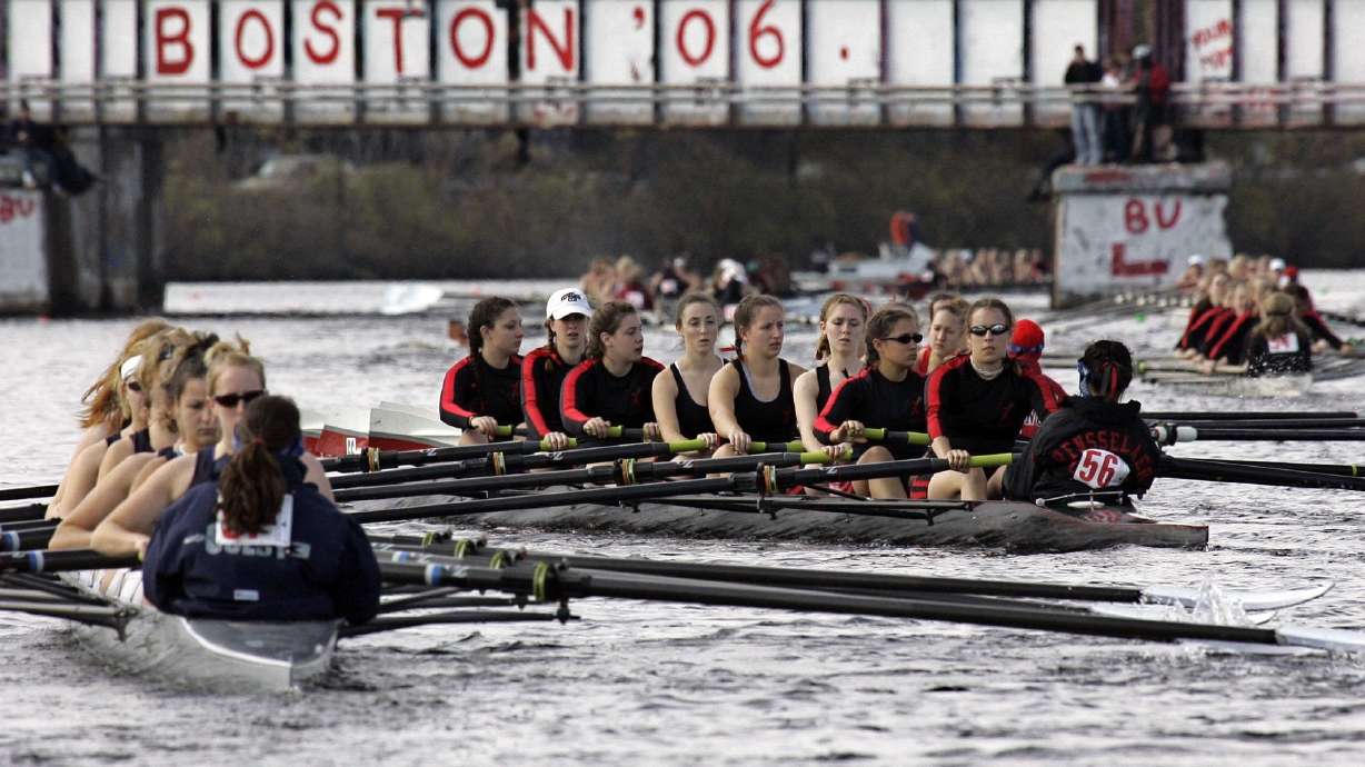 FILE - Competitors head to the starting line for Collegiate Women's Eights during the Head of the Charles Regatta in Cambridge, Mass., Sunday, Oct. 22, 2006. This month marks the 50th anniversary of the Title IX law that requires equitable treatment of men and women in educational programs that receive federal assistance.