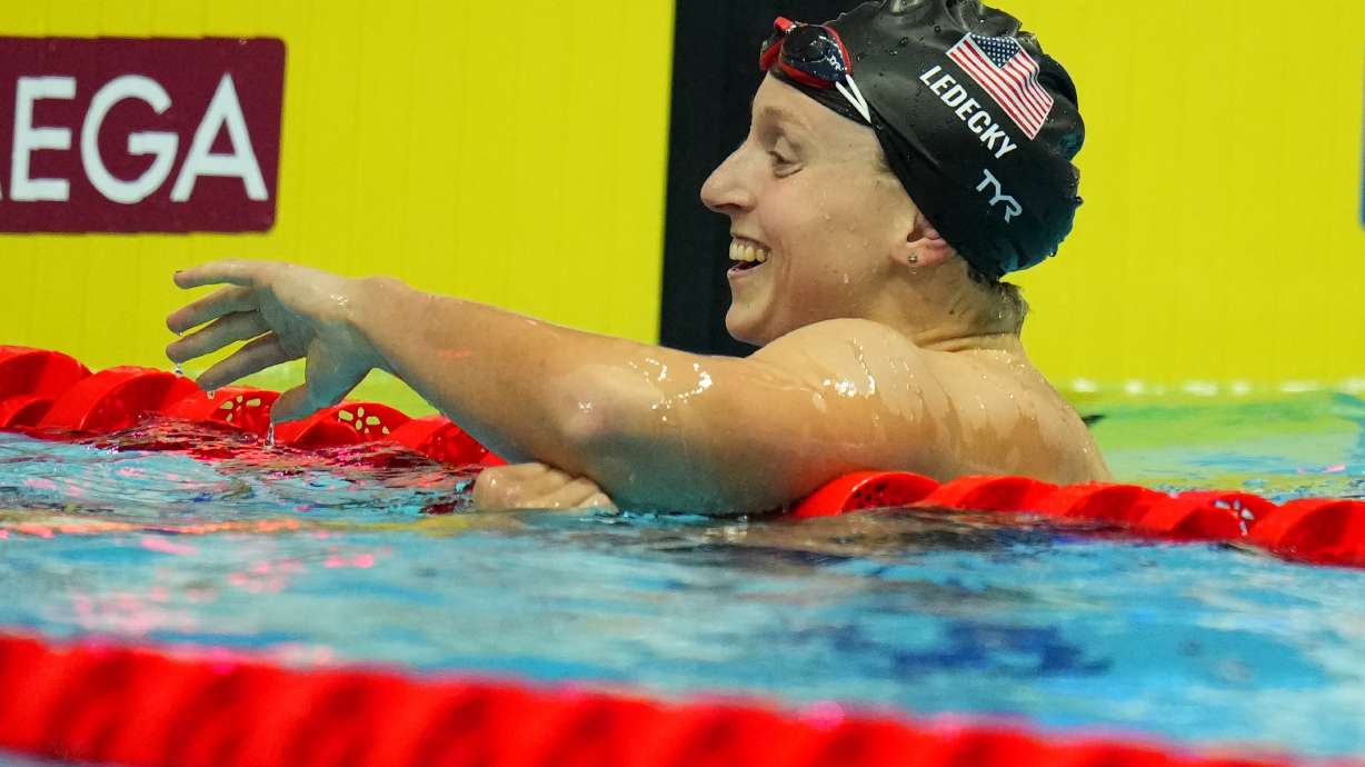 Katie Ledecky of United States celebrates after finishing first in the women's 400m freestyle final at the 19th FINA World Championships in Budapest, Hungary, Saturday, June 18, 2022.