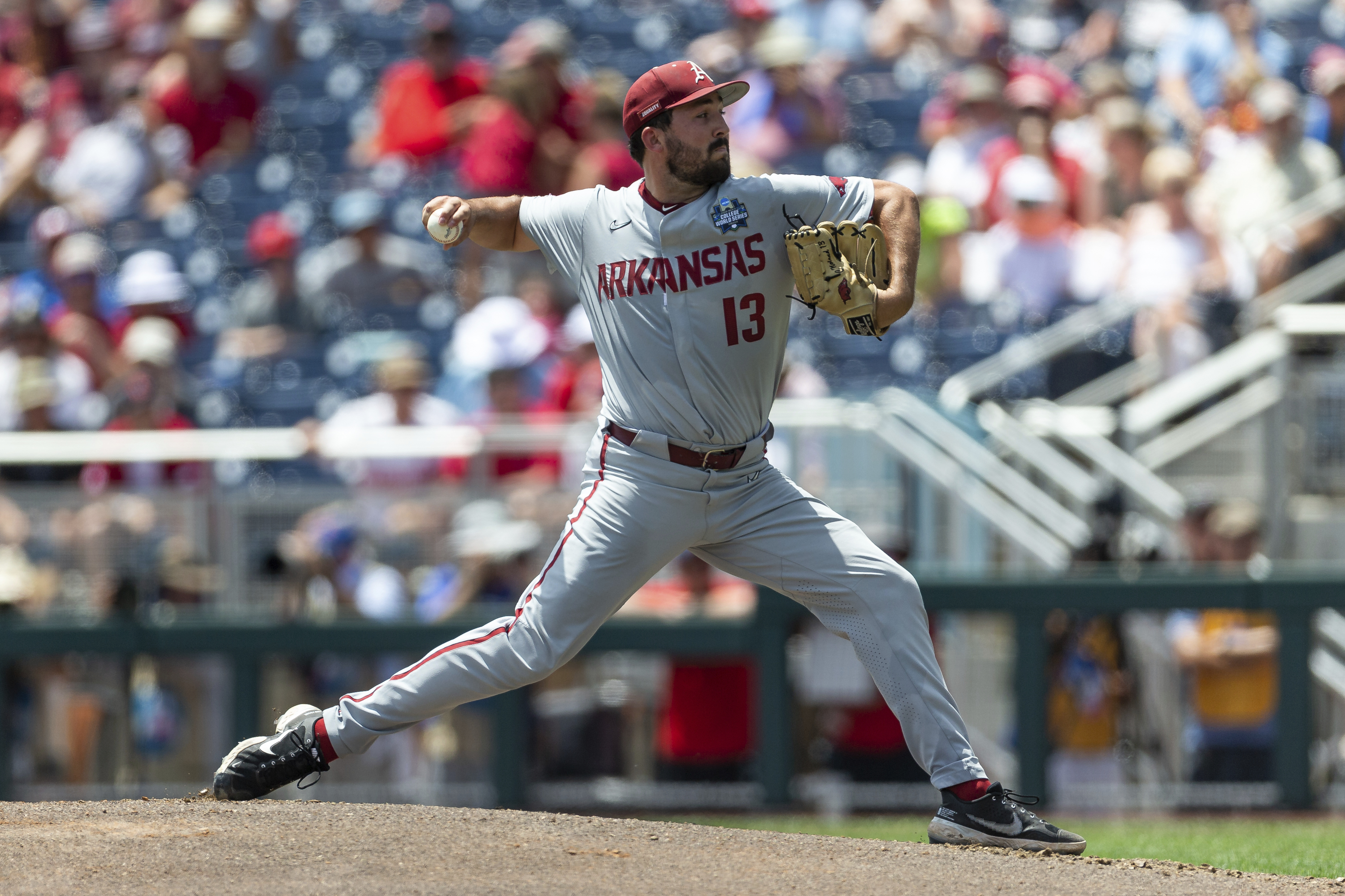 Arkansas starting pitcher Connor Noland (13) throws a pitch against Stanford in the first inning during an NCAA College World Series baseball game Saturday, June 18, 2022, in Omaha, Neb. 