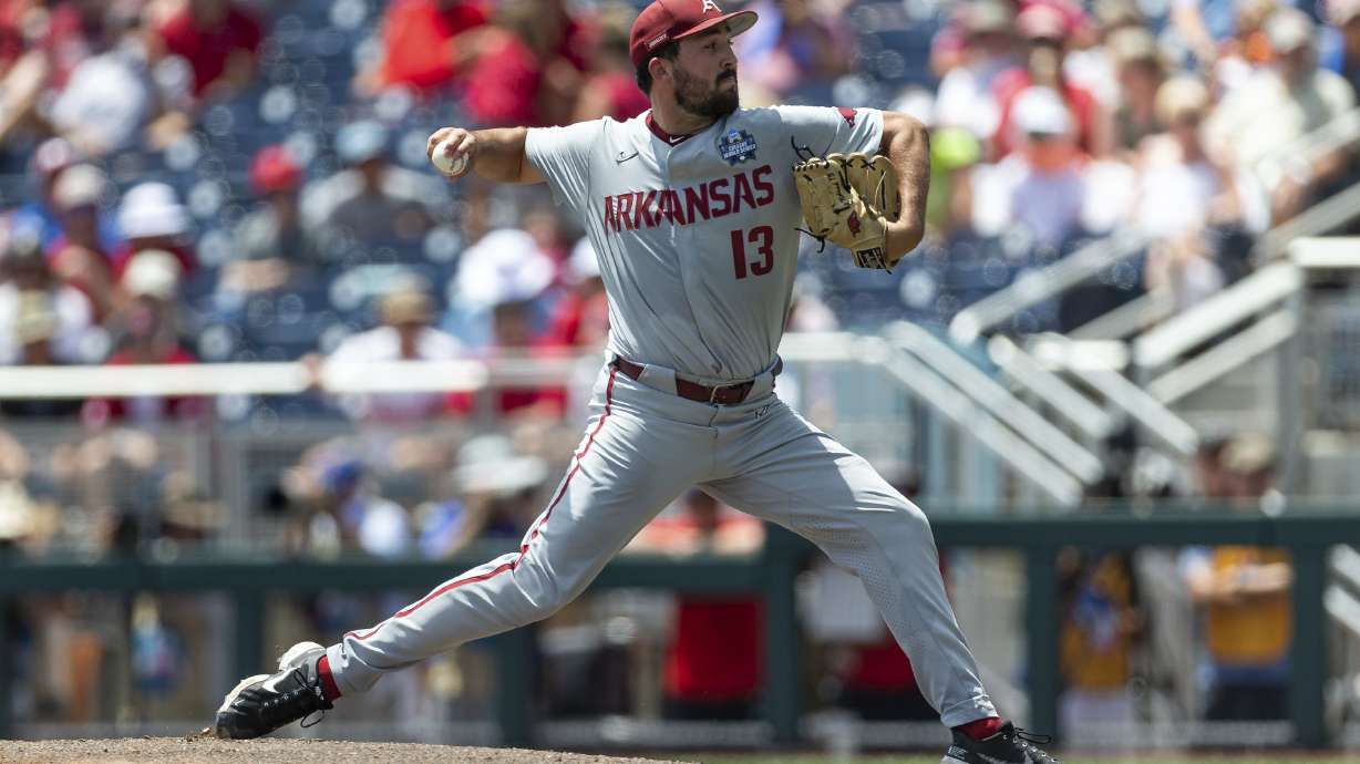 Arkansas starting pitcher Connor Noland (13) throws a pitch against Stanford in the first inning during an NCAA College World Series baseball game Saturday, June 18, 2022, in Omaha, Neb.