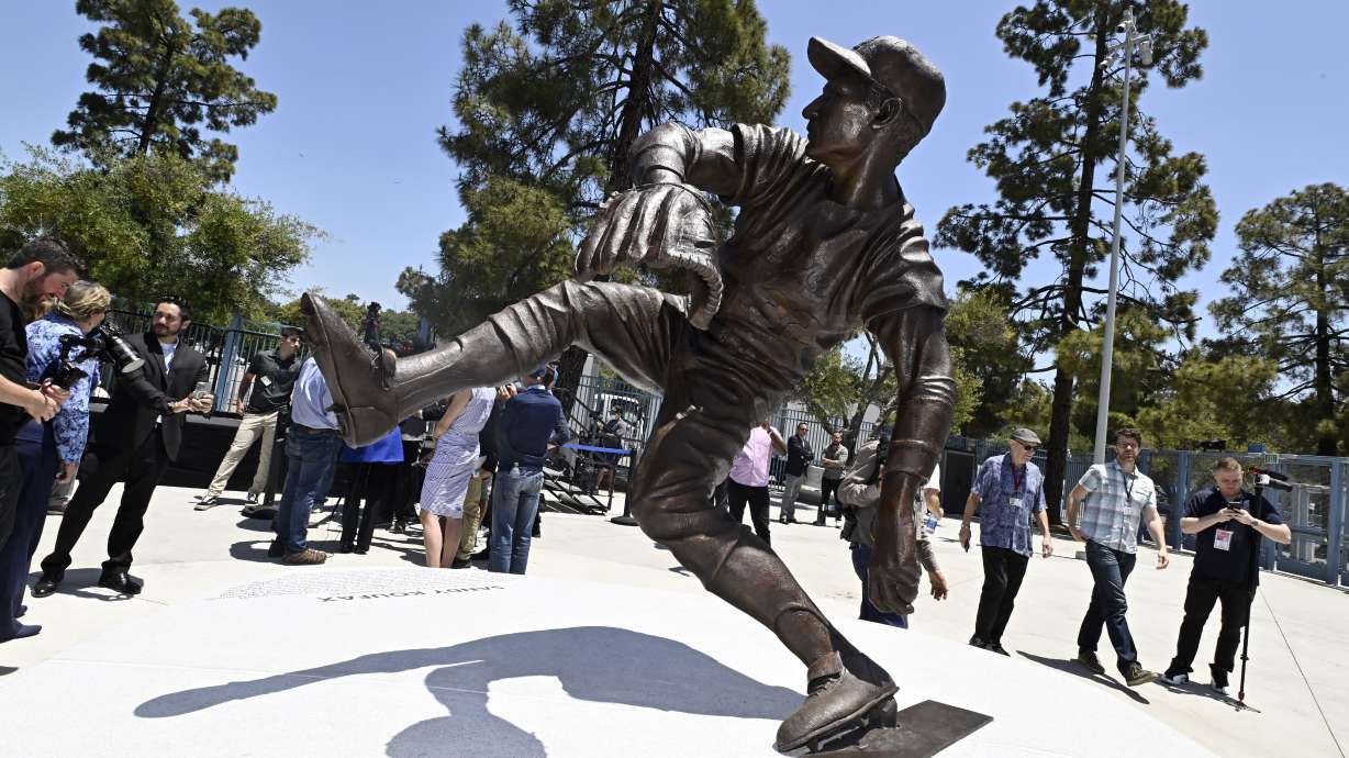 The Los Angeles Dodgers unveil a Sandy Koufax statue in the Centerfield Plaza to honor the Hall of Famer and three-time Cy Young Award winner prior to a baseball game between the Cleveland Guardians and the Dodgers at Dodger Stadium in Los Angeles, Saturday, June 18, 2022.