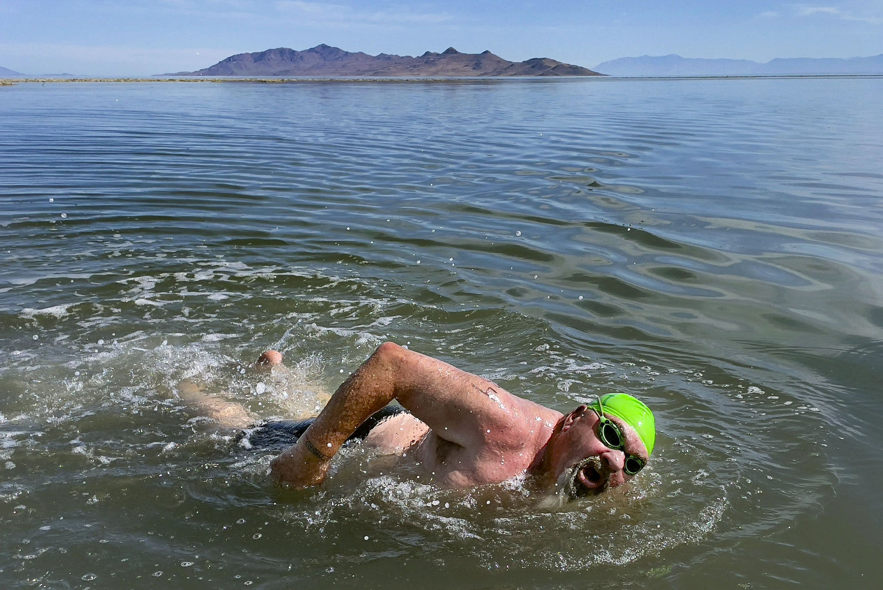 Lane Henderson, of Riverton, competes in a 1-mile open swim competition at Great Salt Lake State Park in Magna on June 11. Intrepid water enthusiasts took to the dwindling waters of the Great Salt Lake last weekend for the annual open swim.