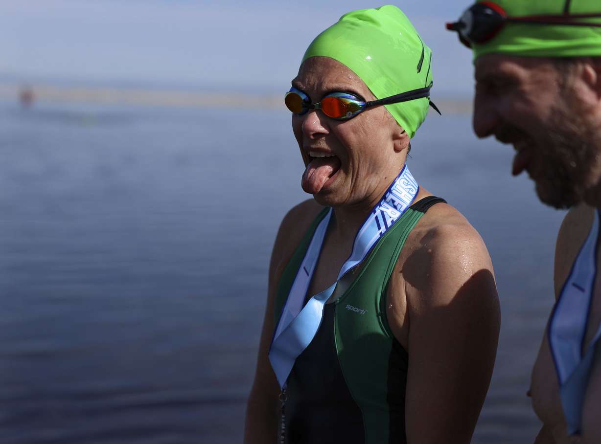 Phyllis Camilleri and Jack Deibert, of Tennessee, remark about having a swollen tongue and salty taste in their mouth after competing in a 1-mile open swim competition at Great Salt Lake State Park on June 11. Intrepid water enthusiasts took to the dwindling waters of the Great Salt Lake last weekend for the annual open swim.