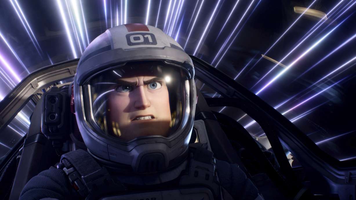 This image released by Disney/Pixar shows character Buzz Lightyear, voiced by Chris Evans, in a scene from the animated film "Lightyear." It earned $51 million at the box office in its debut weekend in North America.