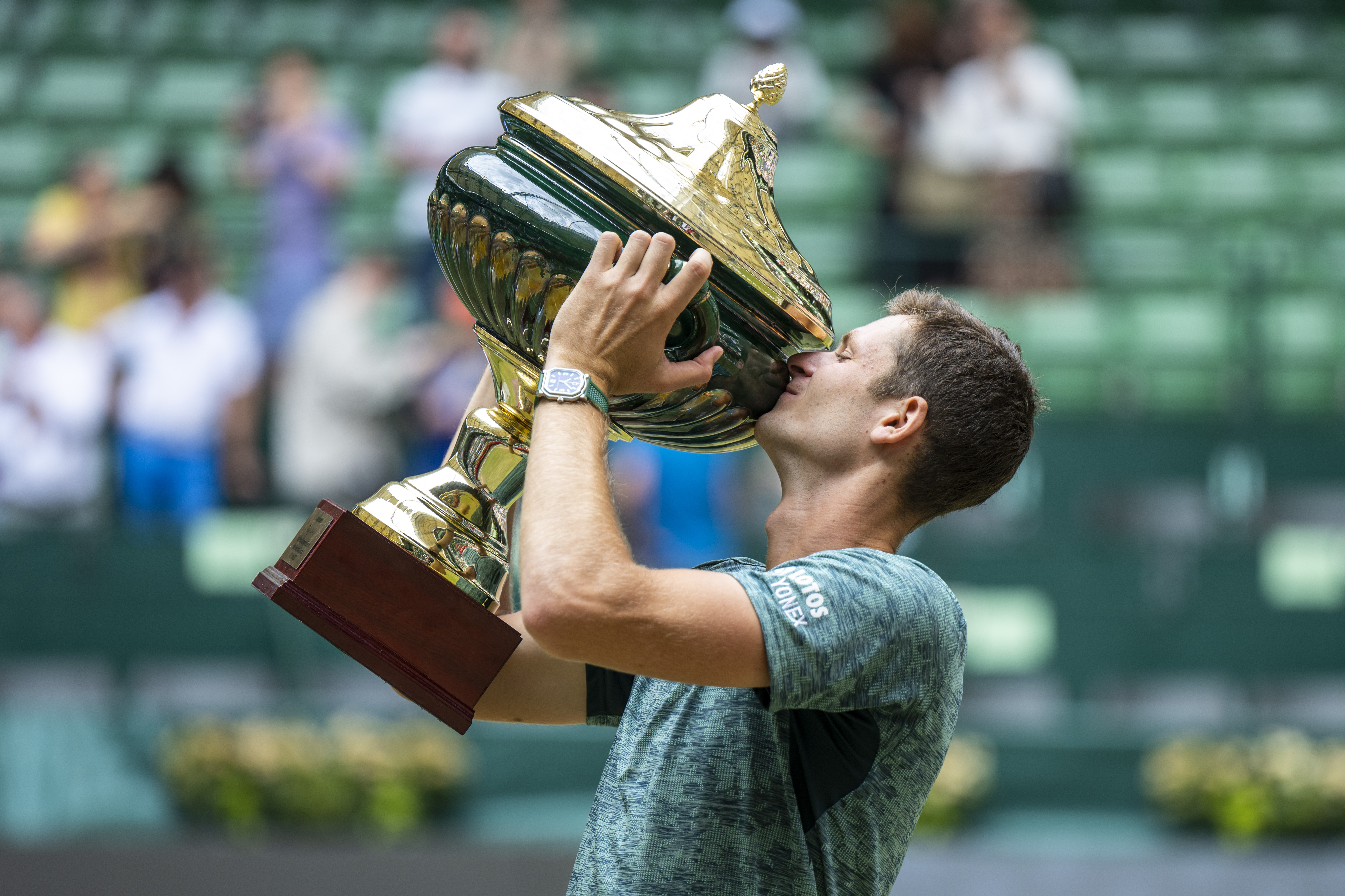 Poland's Hubert Hurkacz presents his winner's trophy after beating Russia Daniil Medvedev during the ATP Tour men's single final tennis match in Halle, Germany, Sunday, June 19, 2022.