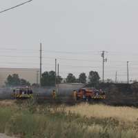 Fire near airport under control; some flights delayed