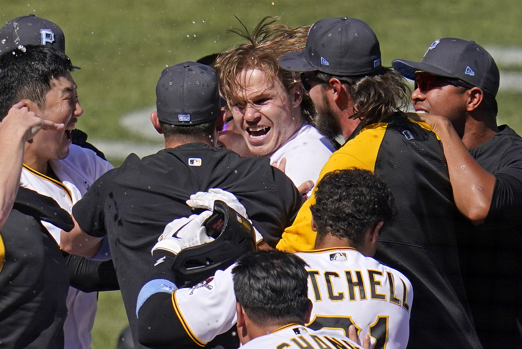 Pittsburgh Pirates' Jack Suwinski, center, is swarmed by teammates after hitting a walkoff solo home run off San Francisco Giants relief pitcher Tyler Rogers during the ninth inning of a baseball game in Pittsburgh, Sunday, June 19, 2022. It was Suwinski's third solo home run of the game. 