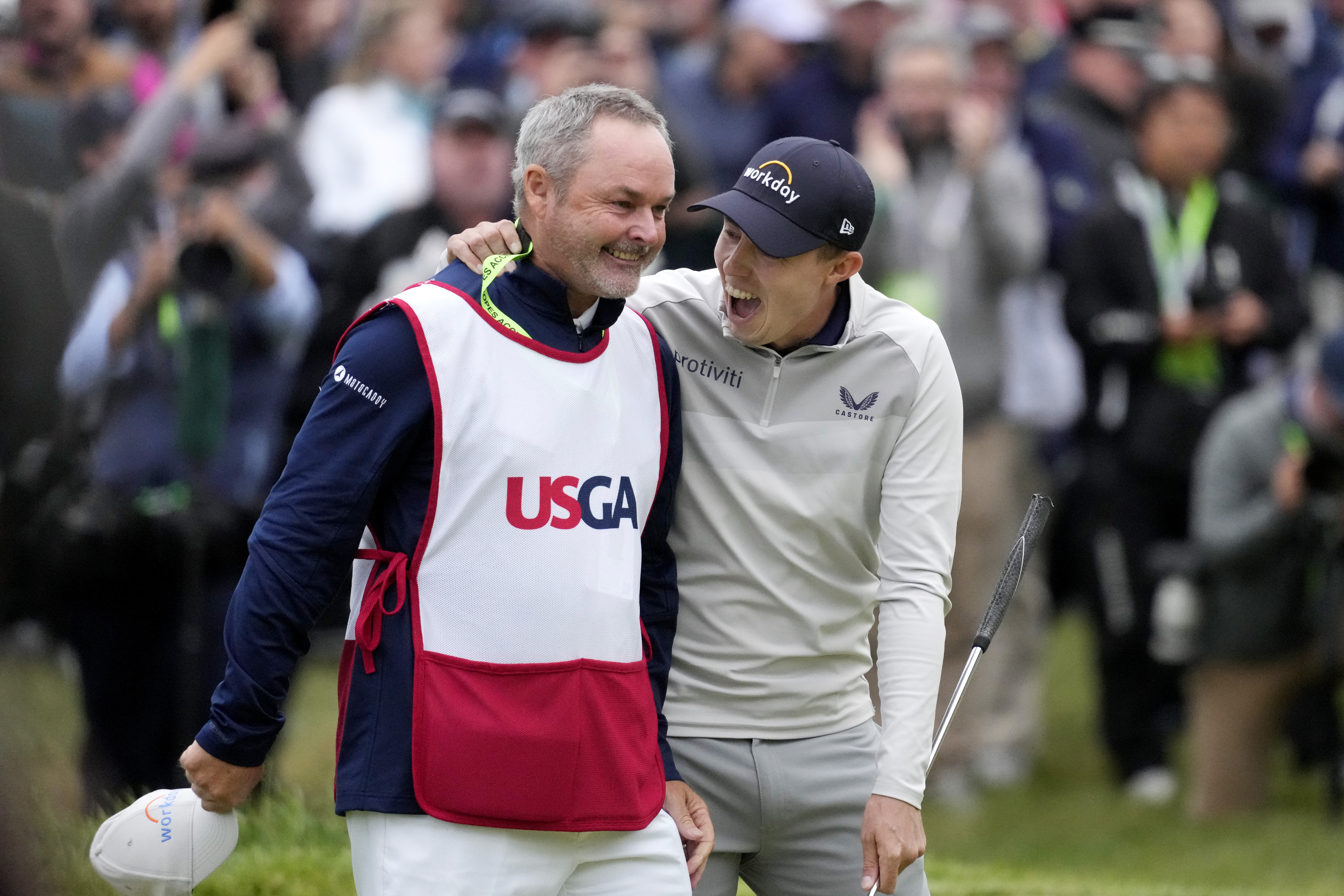 Matthew Fitzpatrick, of England, celebrates with his caddie after winning the U.S. Open golf tournament at The Country Club, Sunday, June 19, 2022, in Brookline, Mass. 