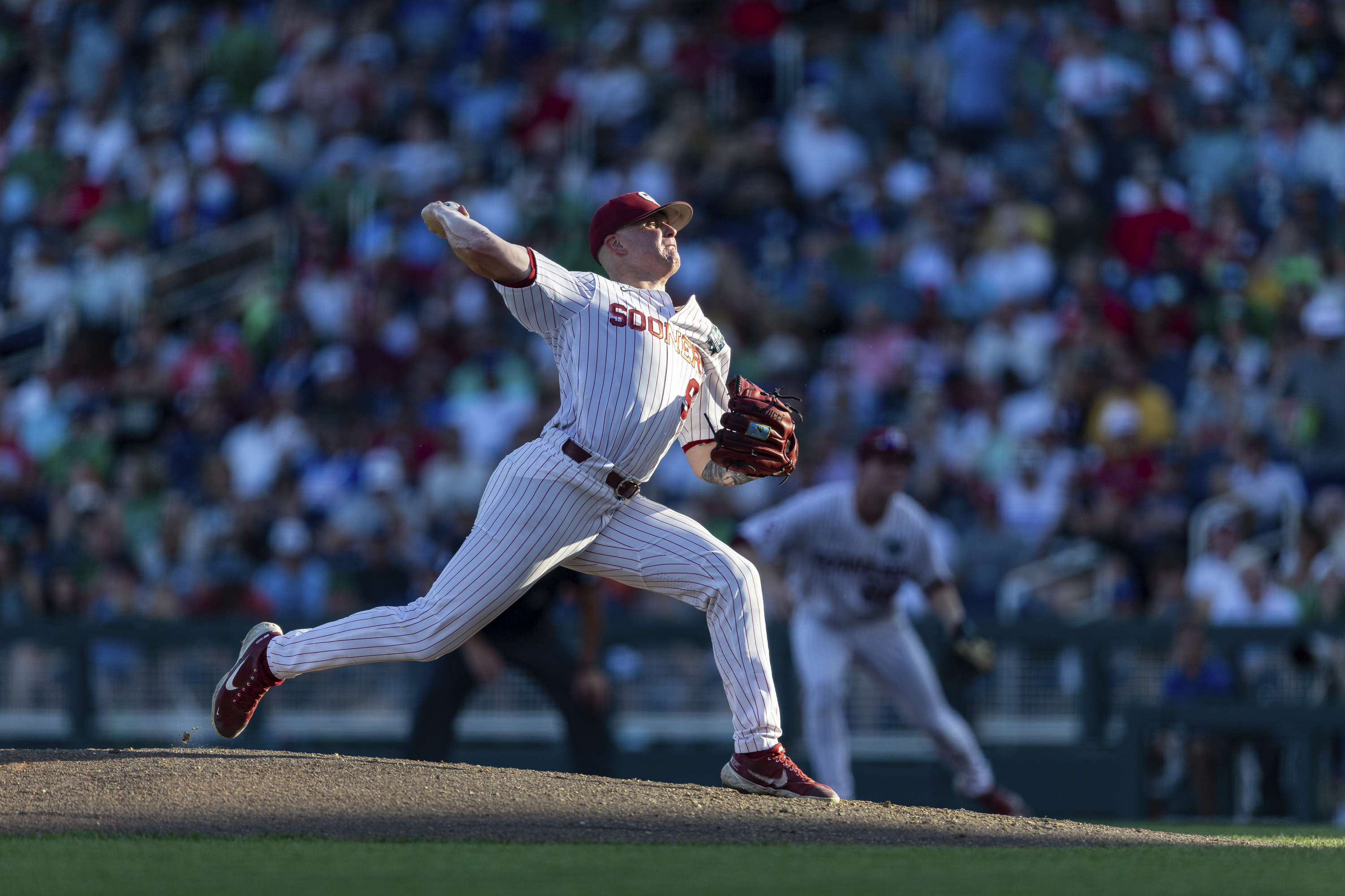 Oklahoma starting pitcher Cade Horton (9) throws a pitch in the second inning against Notre Dame during an NCAA College World Series baseball game, Sunday, June 19, 2022, in Omaha, Neb. 