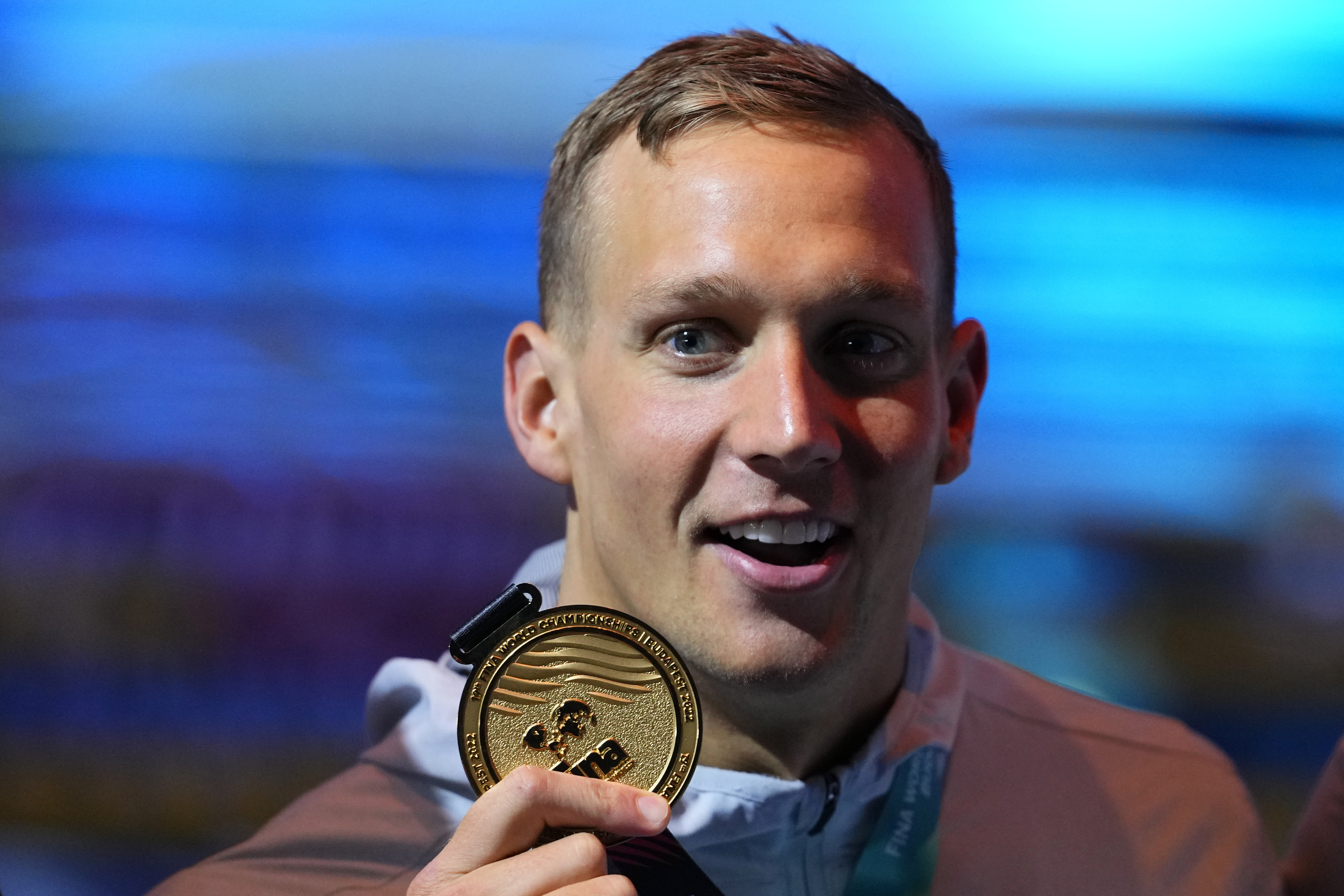 Caeleb Dressel of the United States poses with his medal after winning the Men 50m Butterfly final at the 19th FINA World Championships in Budapest, Hungary, Sunday, June 19, 2022. 