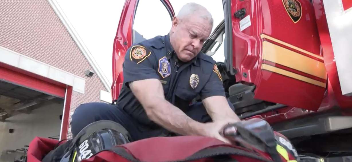 Capt. Scott Winkler looks through items the Salt Lake City Fire Department uses to fight wildland fires on Monday.