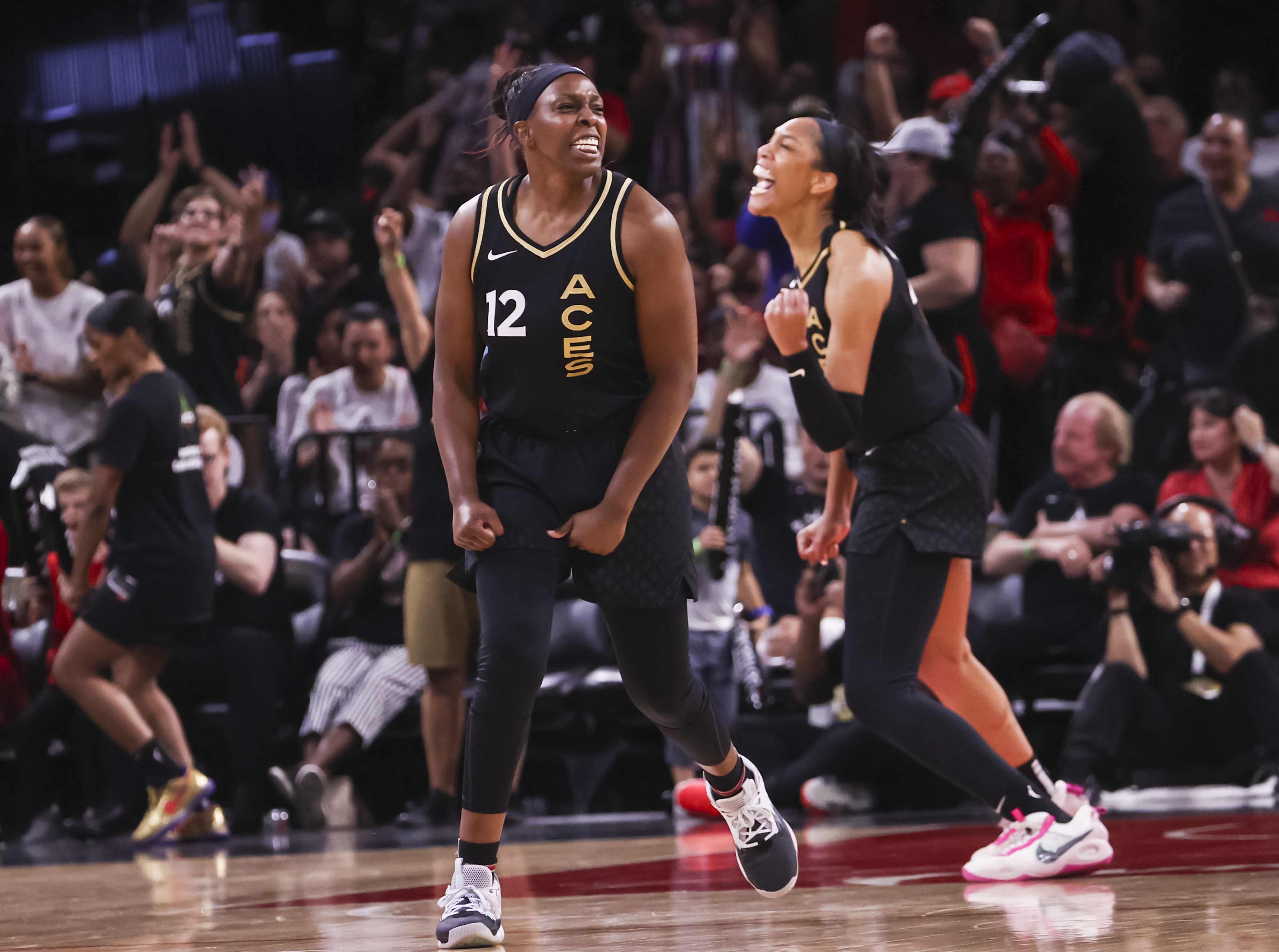 Las Vegas Aces guard Chelsea Gray (12) and forward A'ja Wilson celebrate after a play against the Minnesota Lynx during the second half of a WNBA basketball game Sunday, June 19, 2022, in Las Vegas. 