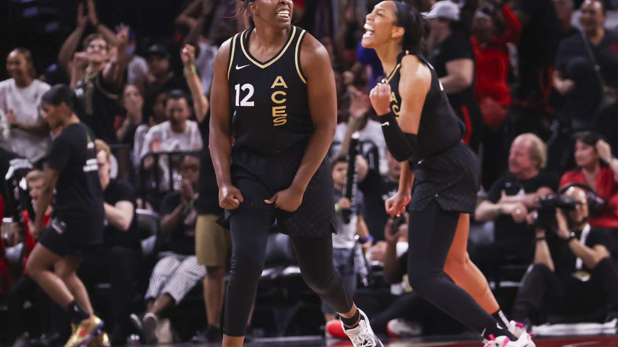 Las Vegas Aces guard Chelsea Gray (12) and forward A'ja Wilson celebrate after a play against the Minnesota Lynx during the second half of a WNBA basketball game Sunday, June 19, 2022, in Las Vegas.