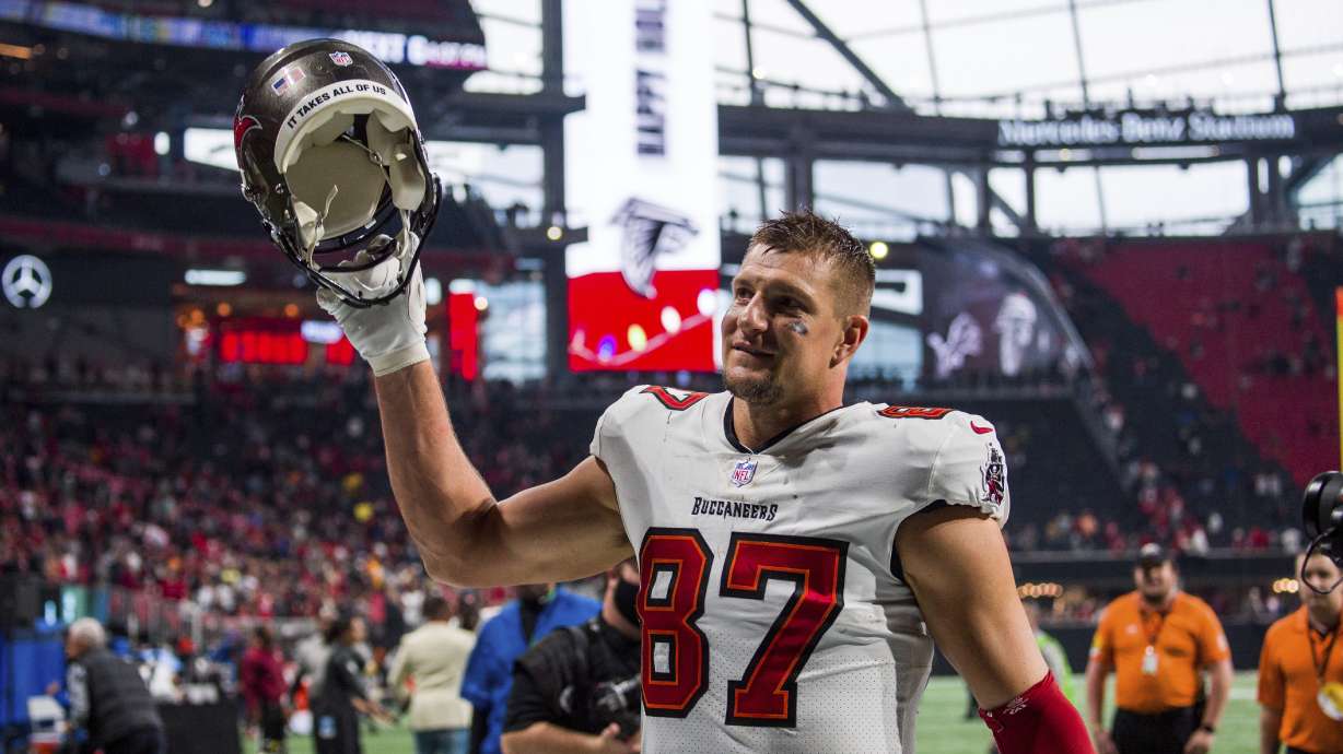 FILE - Tampa Bay Buccaneers tight end Rob Gronkowski (87) waves to fans after an NFL football game, Sunday, Dec. 5, 2021, in Atlanta. The Tampa Bay Buccaneers won 30-17. Four-time All-Pro tight end Rob Gronkowski announced his retirement again, Tuesday, June 21, 2022.