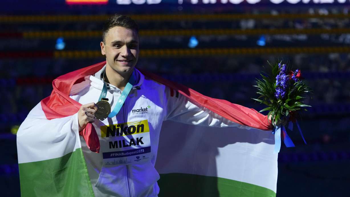 Kristof Milak of Hungary celebrate after winning the Men 200m Butterfly final at the 19th FINA World Championships in Budapest, Hungary, Tuesday, June 21, 2022.
