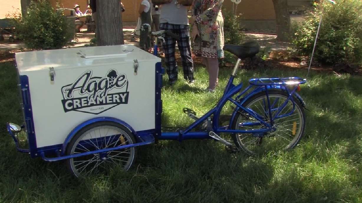 An Aggie Creamery Icicle Tricycle is parked outside of the Aggie Creamery on Tuesday as Utah State University celebrates Aggie Ice Cream Day.
