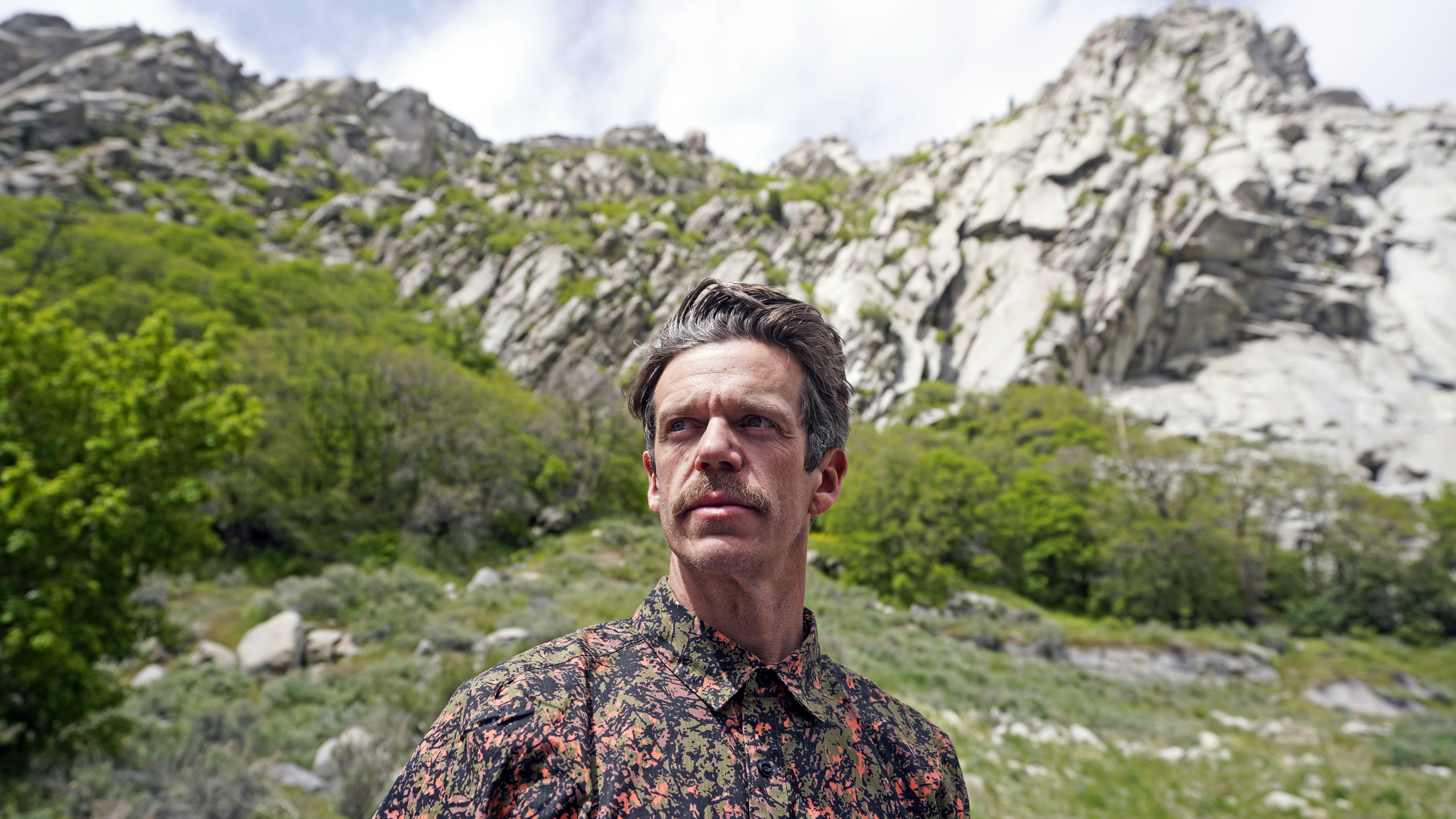 Jonathon Golden, a former federal firefighter, poses for a photograph on May 19, in Little Cottonwood Canyon, near Salt Lake City. Firefighter groups are applauding steps taken by the Biden administration to temporarily raise wages for the men and women on the front lines of the nation's largest wildfires. “It’s an effort and an attempt to try to to keep people at their jobs,” said Golden. “But it still falls woefully short of the pay in municipal departments and other state agencies.”
