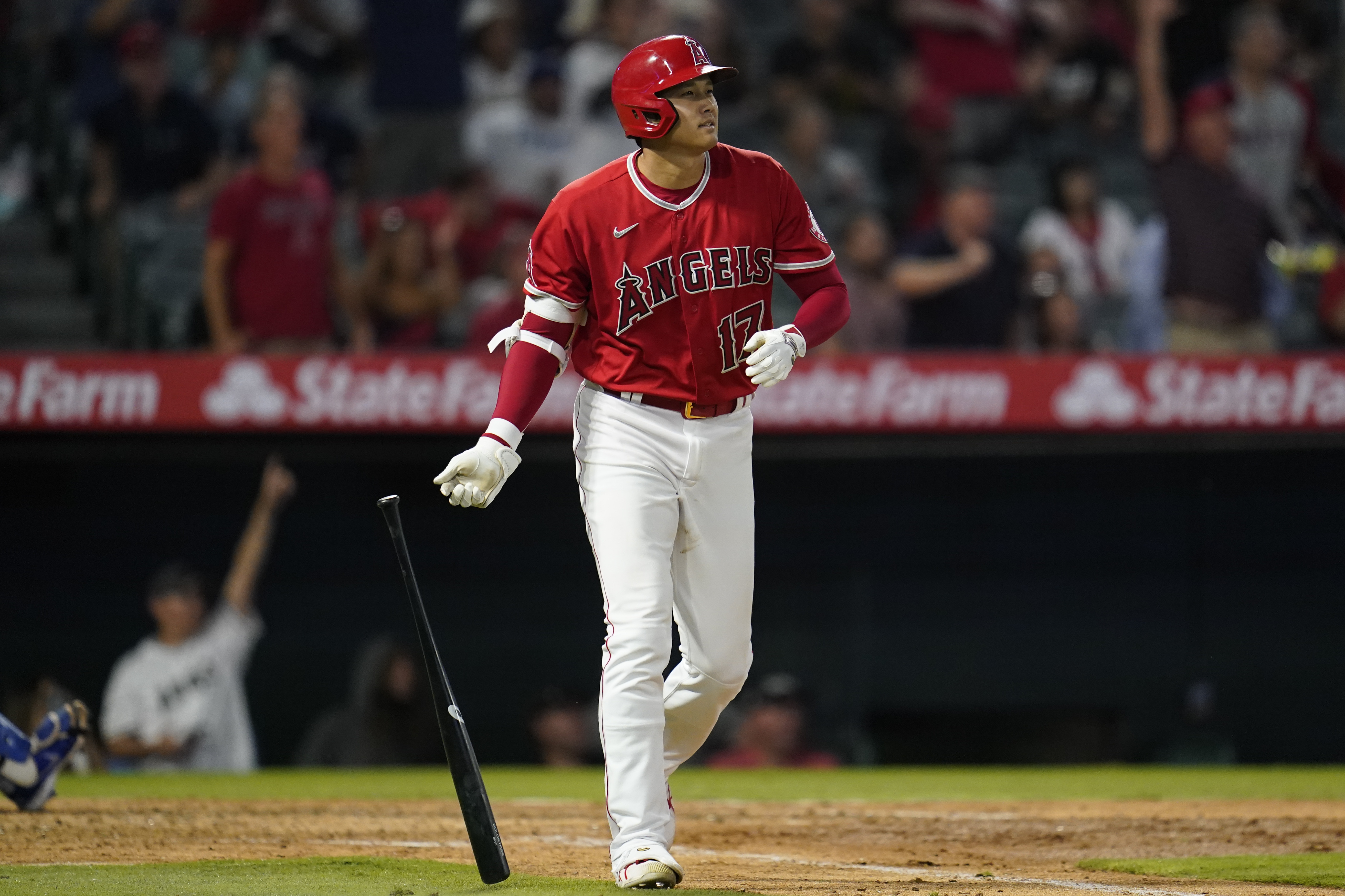 Los Angeles Angels designated hitter Shohei Ohtani (17) runs the bases after hitting a home run during the sixth inning of a baseball game against the Kansas City Royals in Anaheim, Calif., Tuesday, June 21, 2022. Taylor Ward and Mike Trout also scored. 