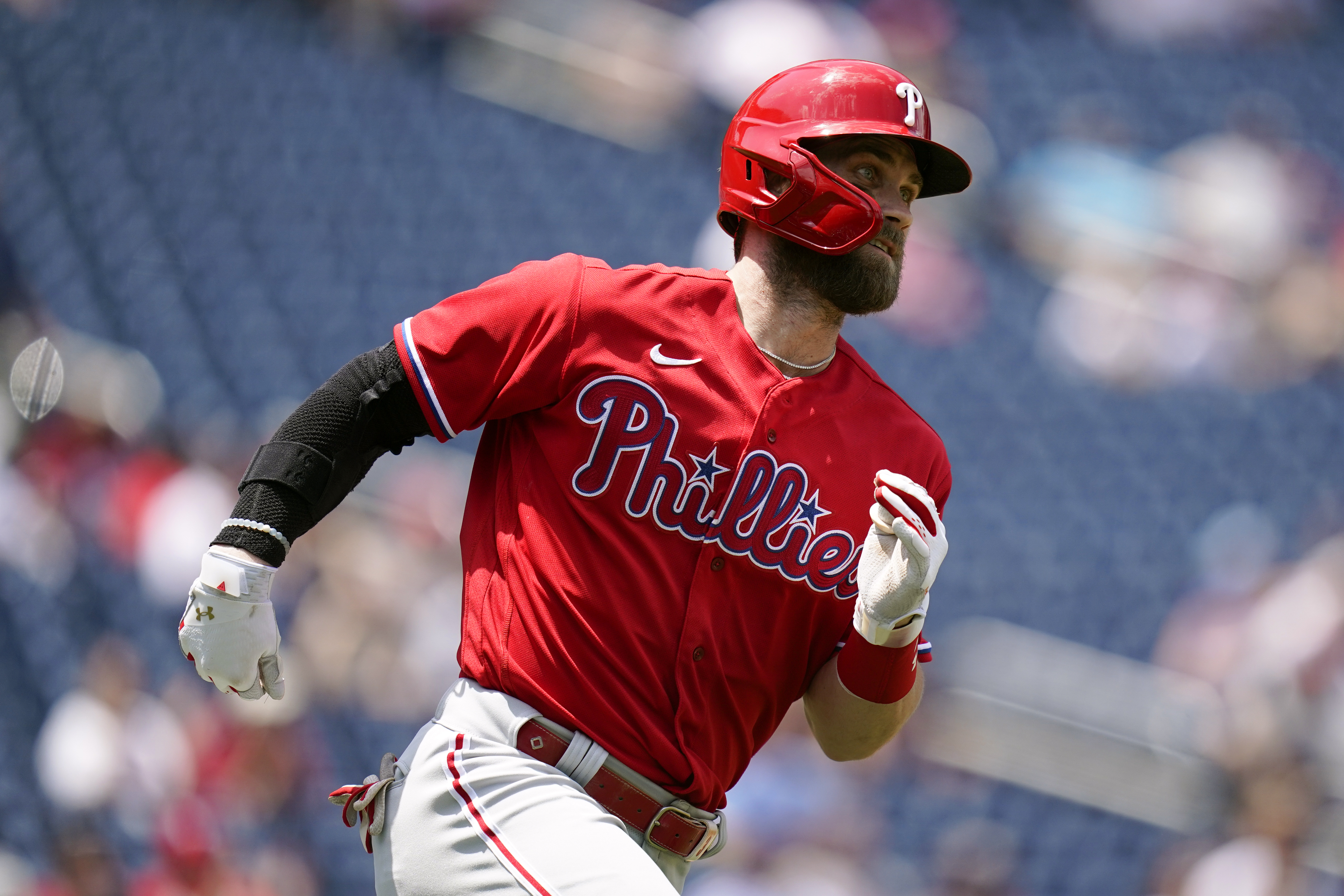 Philadelphia Phillies designated hitter Bryce Harper singles in the third inning of the first game of a baseball doubleheader against the Washington Nationals, Friday, June 17, 2022, in Washington. 