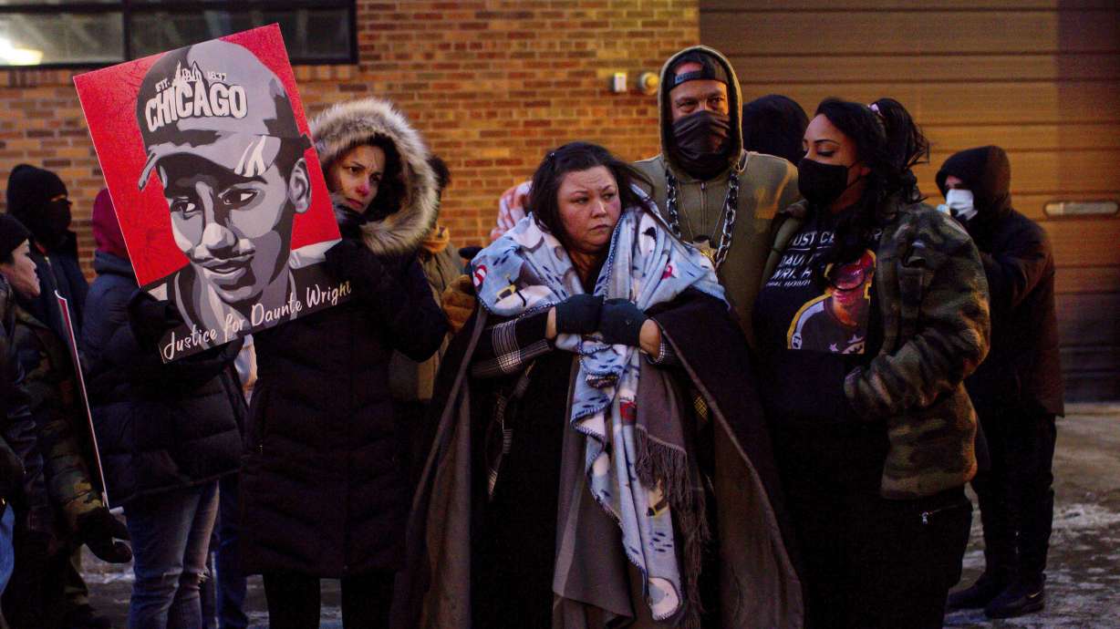 Katie Bryant, Daunte Wright's mother, is surrounded by community members and activists at the apartment building where activists say Hennepin County Judge Regina Chu lives after former officer Kim Potter was sentenced to two years in prison Feb. 18, in Minneapolis. The suburban Minneapolis city has agreed to pay $3.2 million to the family of Daunte Wright, a Black man who was fatally shot by a police officer who said she confused her gun for her Taser.
