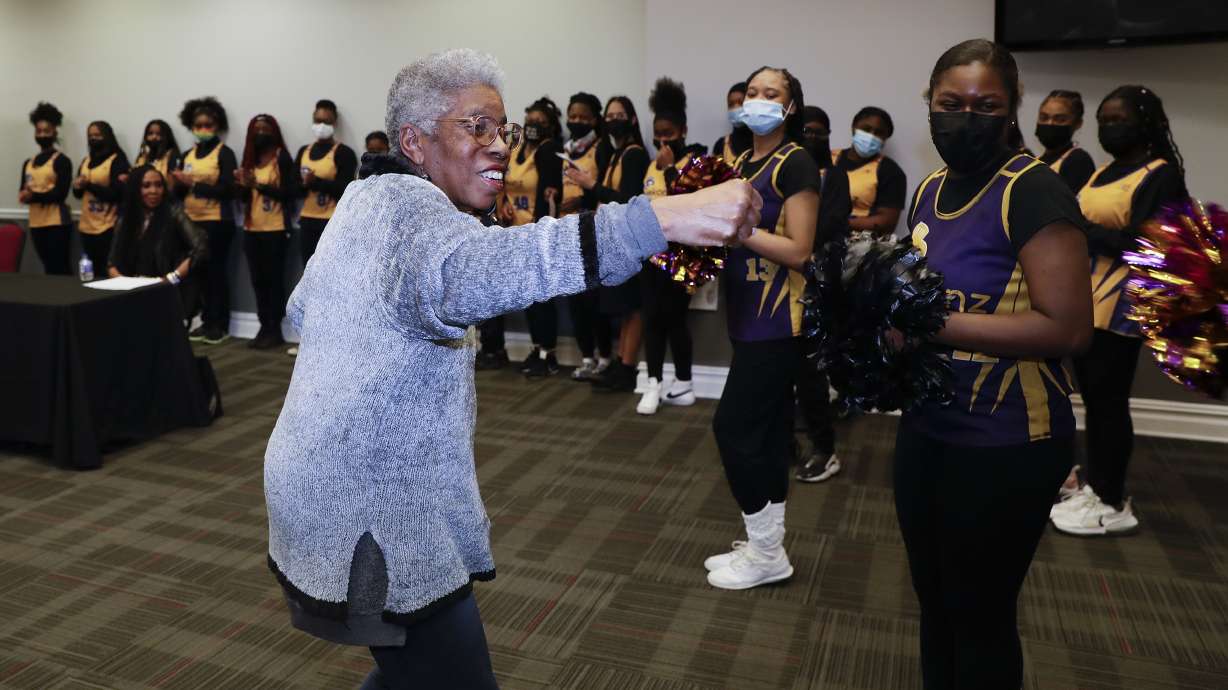 Former Temple lacrosse head coach Tina Sloan Green puts out her fist after announcing she will serve as an honorary coach for the Eyekonz lacrosse team, in Philadelphia, Monday, Feb. 28, 2022. Once Tina Sloan Green took over the lacrosse program at Temple University in the years after the passage of Title IX, the landmark gender-equity law, she never stopped thinking about the girls who weren't playing.