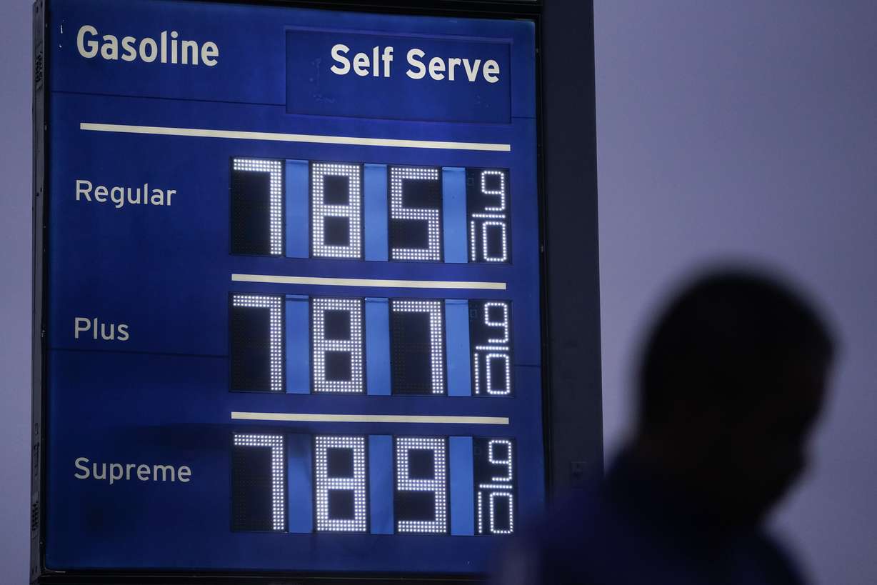 High gas prices are shown as a pedestrian waits to cross the street in Los Angeles, Thursday.